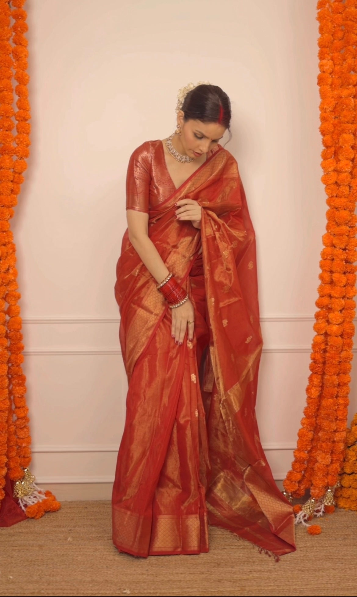 Red maheshwari tissue silk saree with flower motifs all over