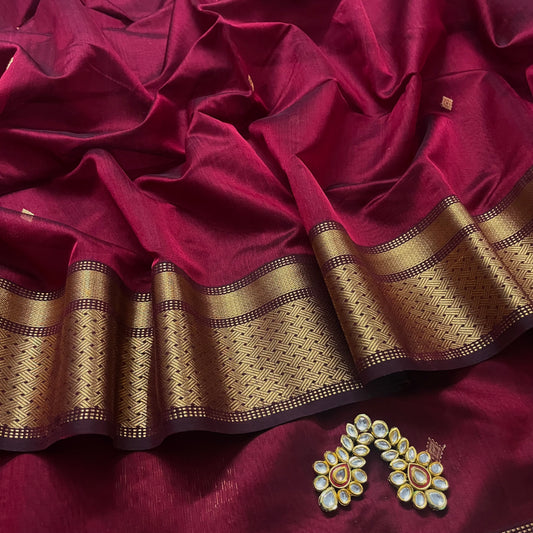 Deep maroon Maheshwari saree with zari motifs on pallu