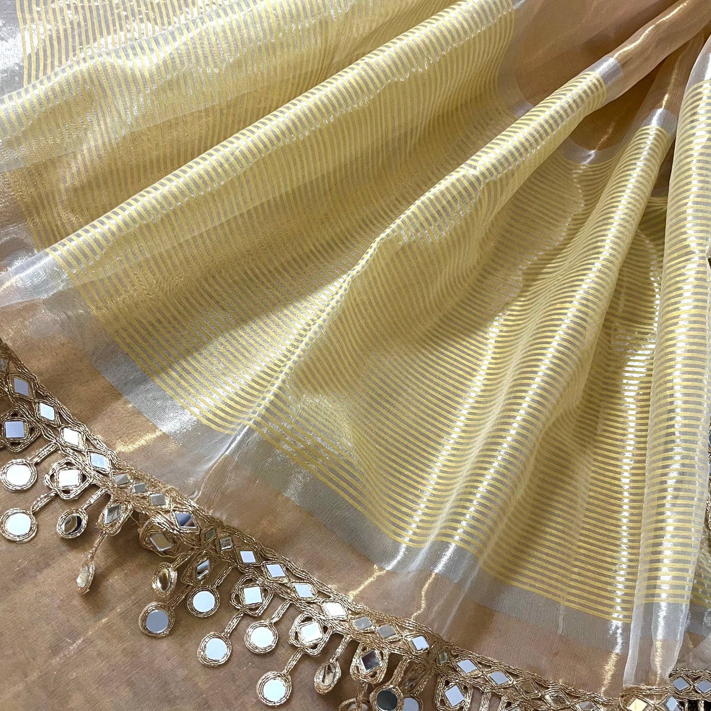 Molten gold chanderi tissue silk saree with dangling mirror work border