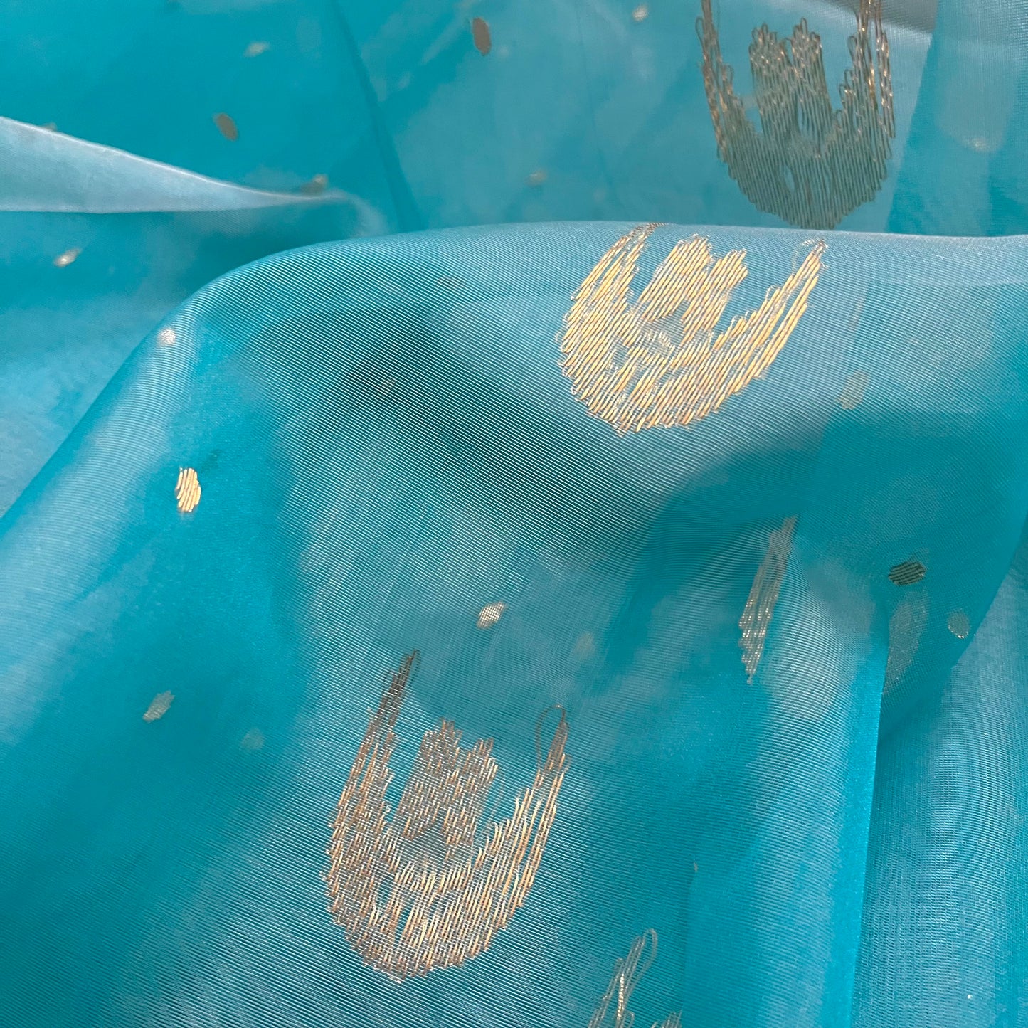 Aqua blue chanderi organza silk saree with zari bootis and chaand bootis all over