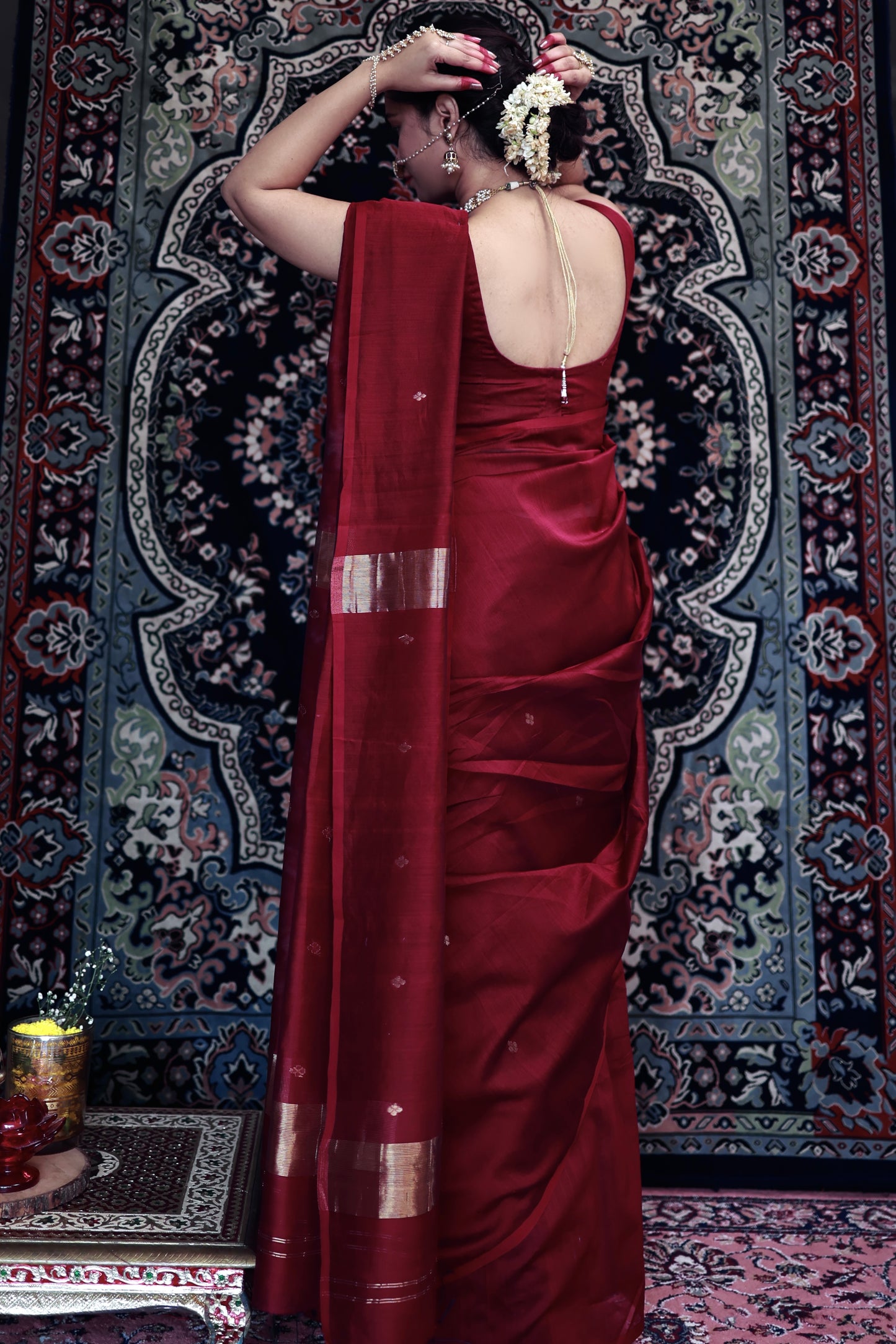 Deep maroon Maheshwari saree with zari bootis all over