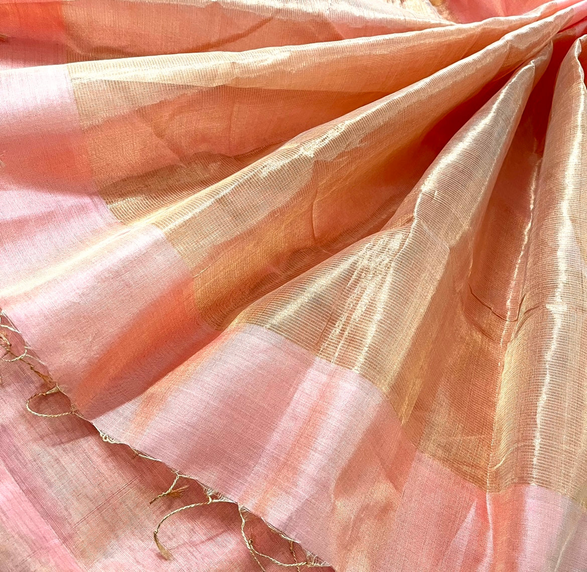 Peachish Pink Maheshwari tissue silk saree with Zari lines on Pallu