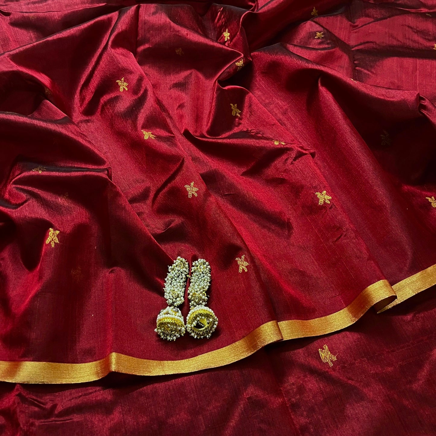 Deep maroon chanderi silk saree with flower bootis all over