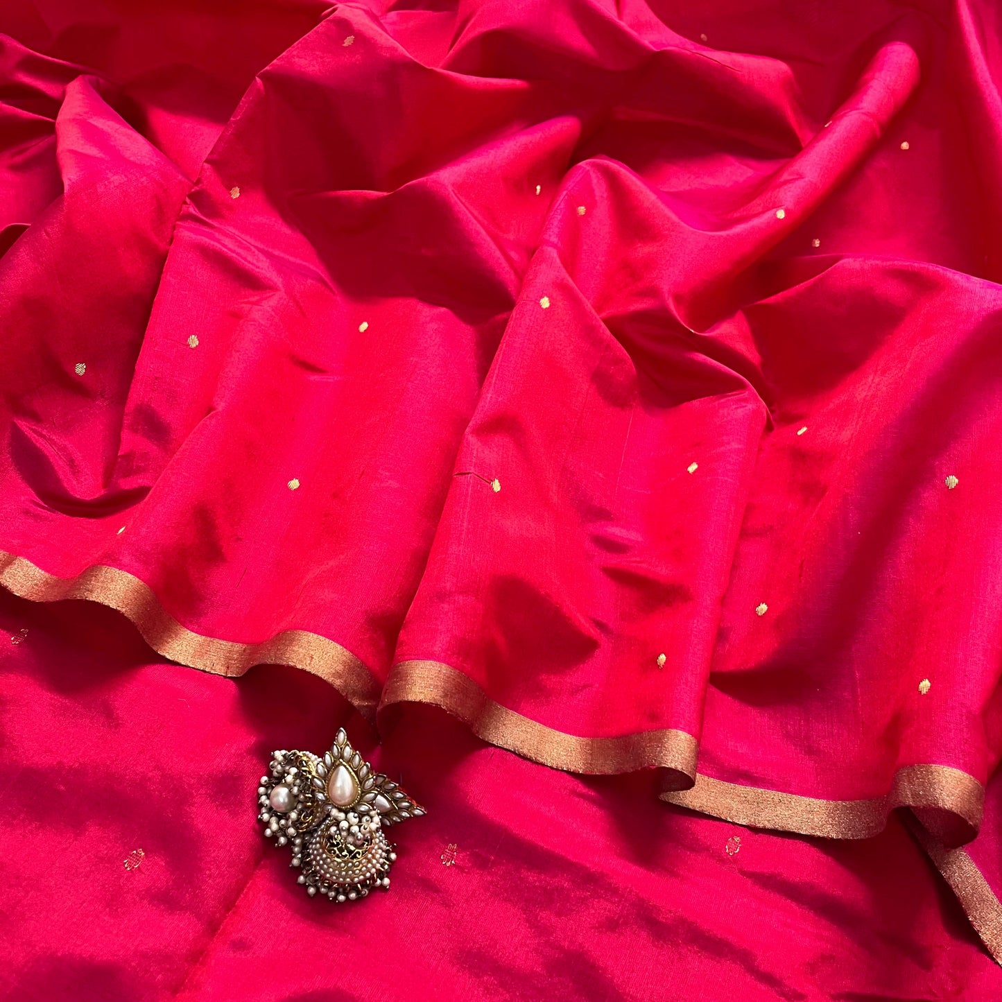 Crimson red chanderi silk saree with zari bootis all over