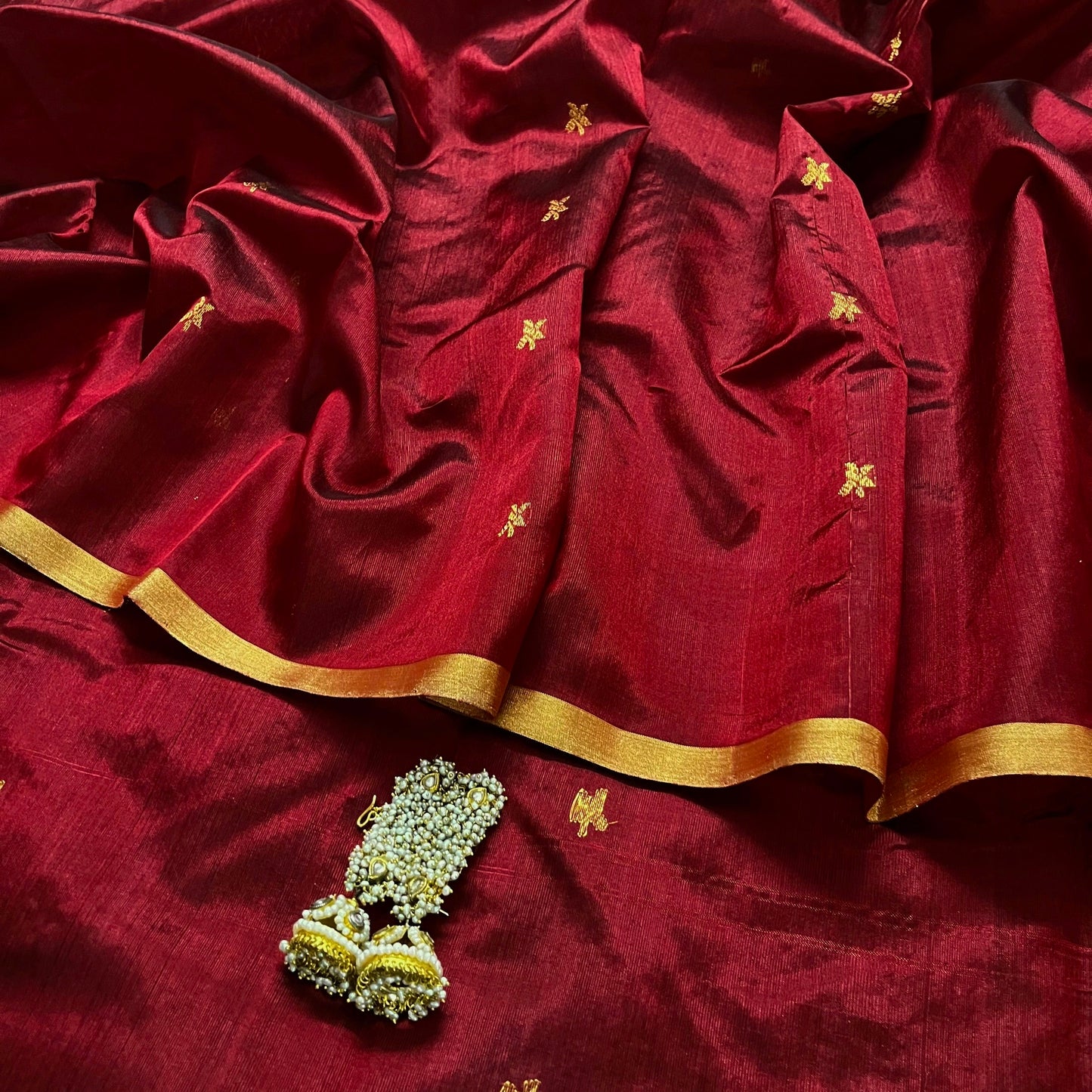 Deep maroon chanderi silk saree with flower bootis all over