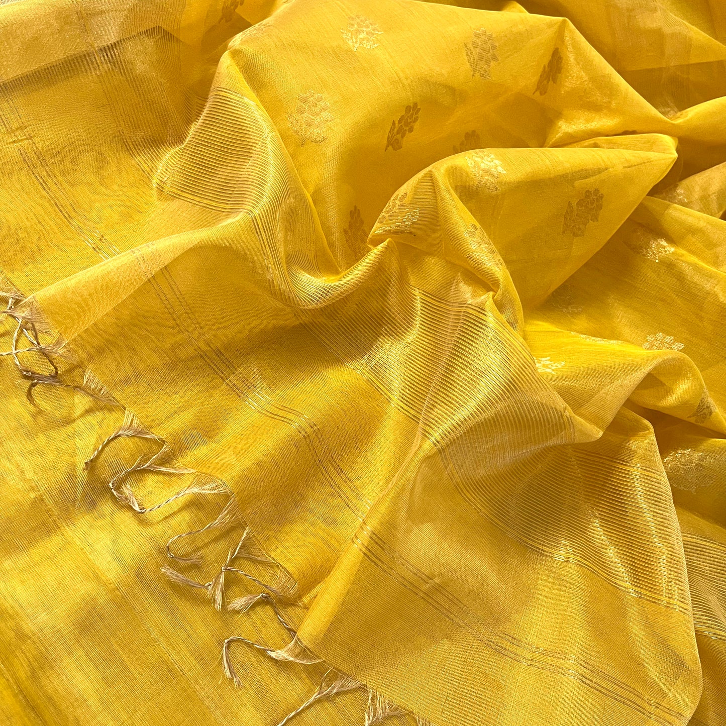 Yellow maheshwari tissue silk saree with flower motifs all over