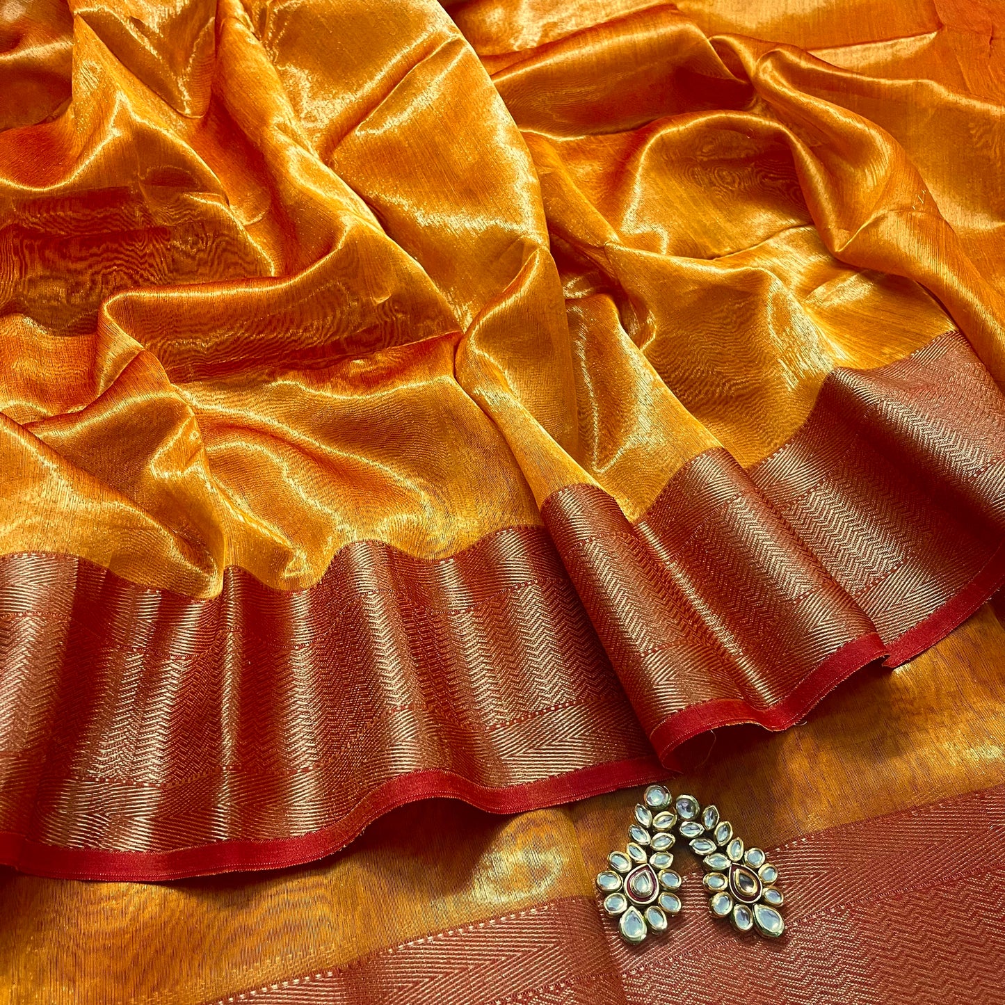 Mustard and red maheshwari tissue silk saree with zari pattern on pallu