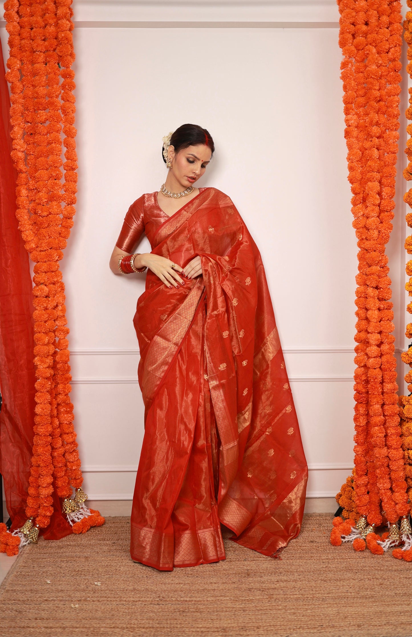 Red maheshwari tissue silk saree with flower motifs all over