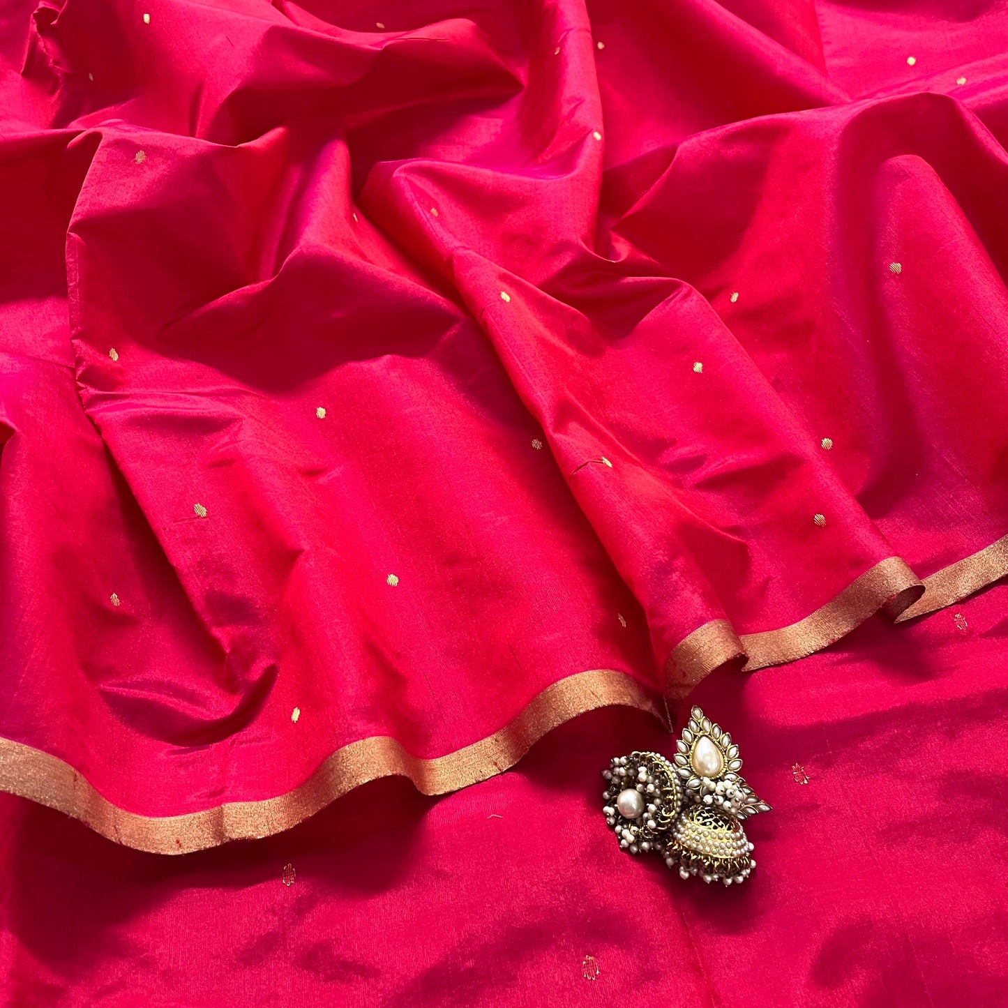 Crimson red chanderi silk saree with zari bootis all over