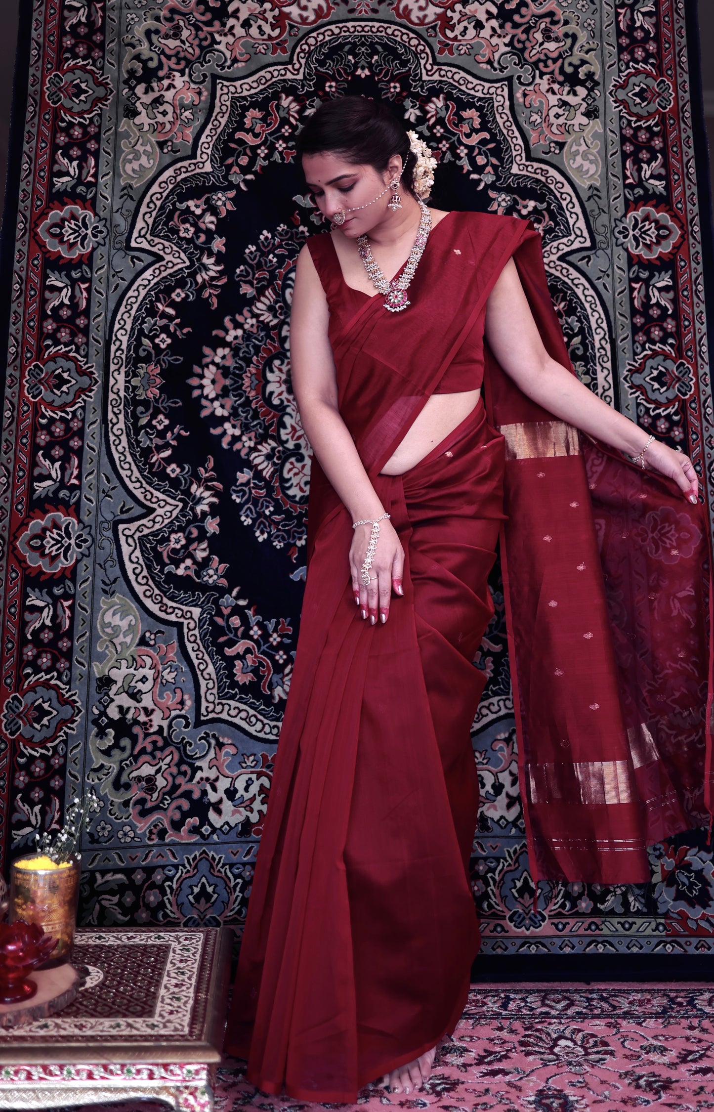 Deep maroon Maheshwari saree with zari bootis all over