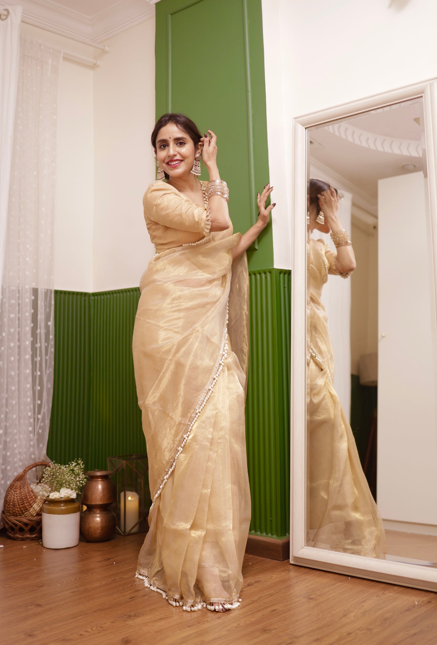 Molten gold chanderi tissue silk saree with dangling pearl border