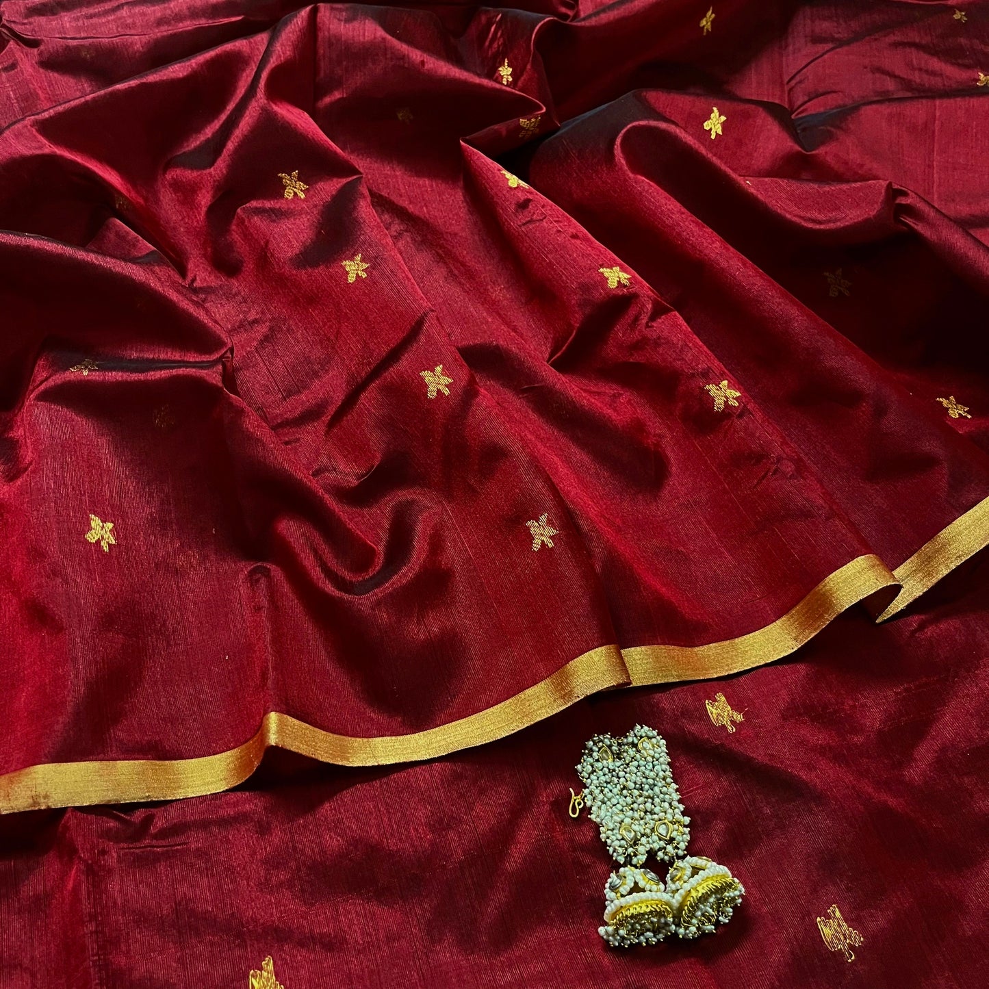 Deep maroon chanderi silk saree with flower bootis all over