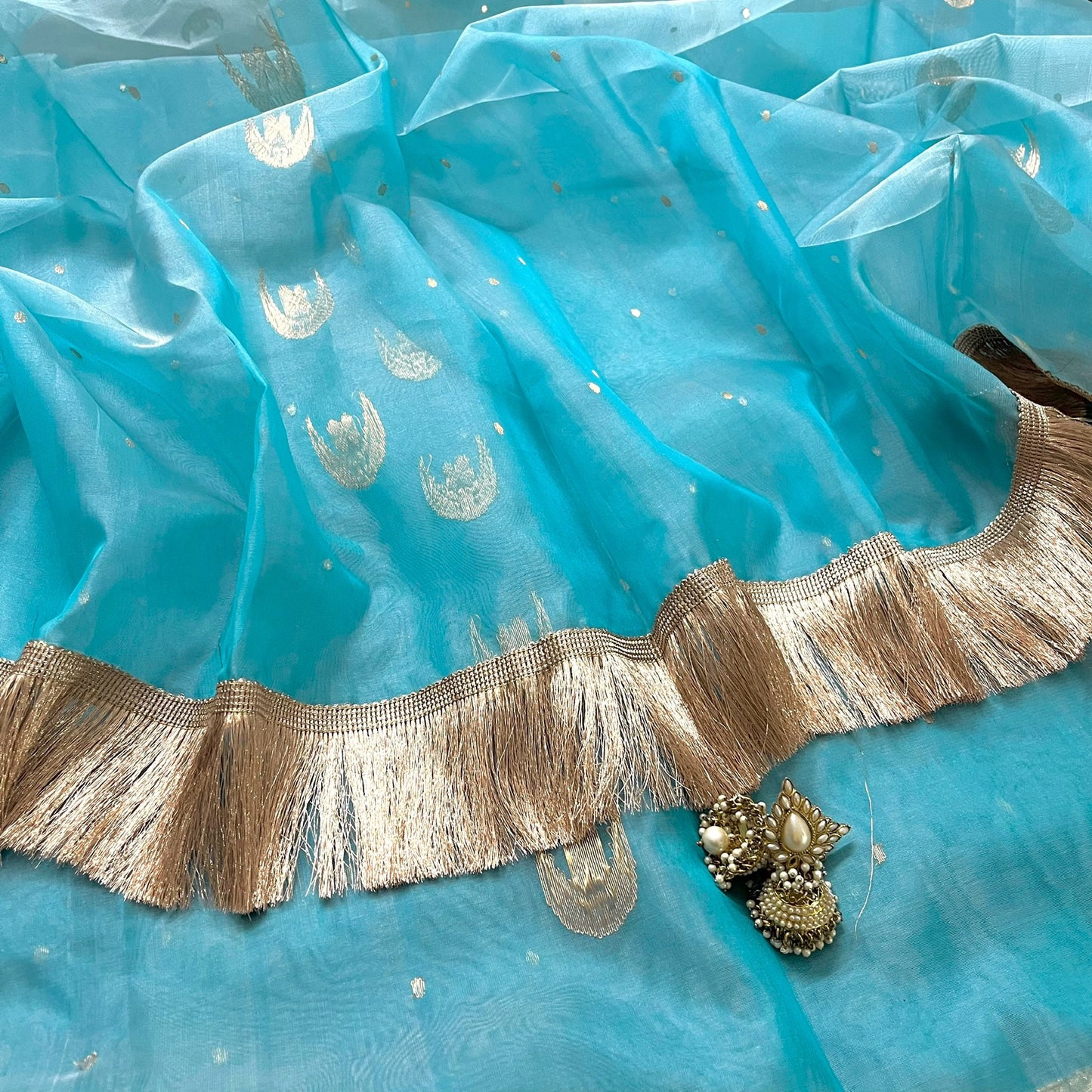 Aqua blue chanderi organza silk saree with zari bootis and chaand bootis all over