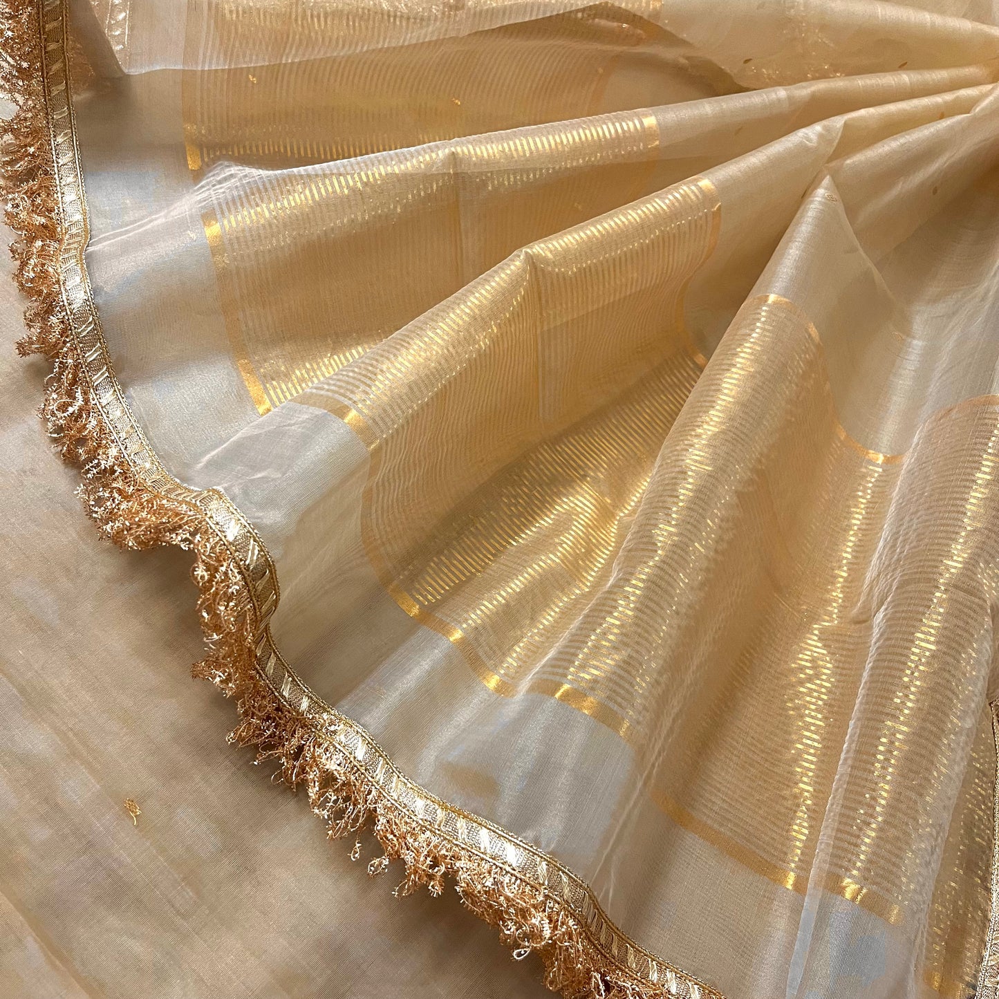 Beige gold Chanderi organza silk saree with zari bootis all over