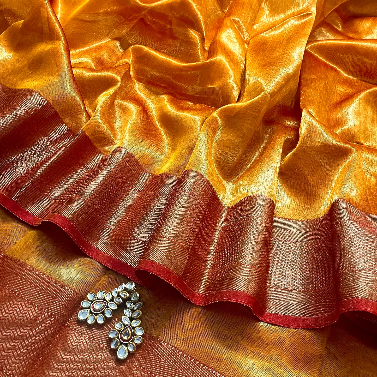 Mustard and red maheshwari tissue silk saree with zari pattern on pallu