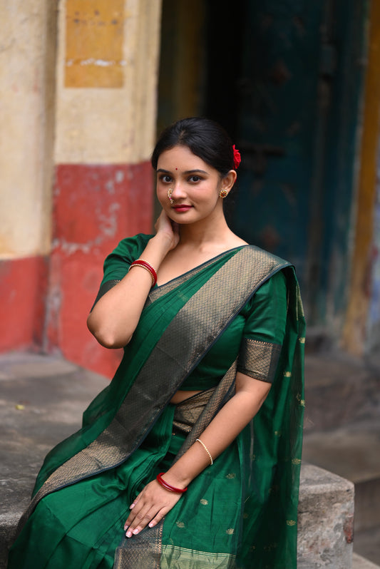 Dark green maheshwari with saree with flower bootis all over