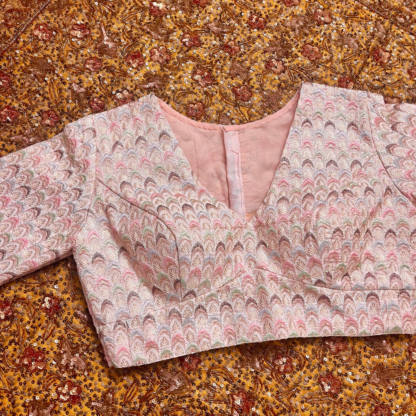 Light pink blouse with threadwork