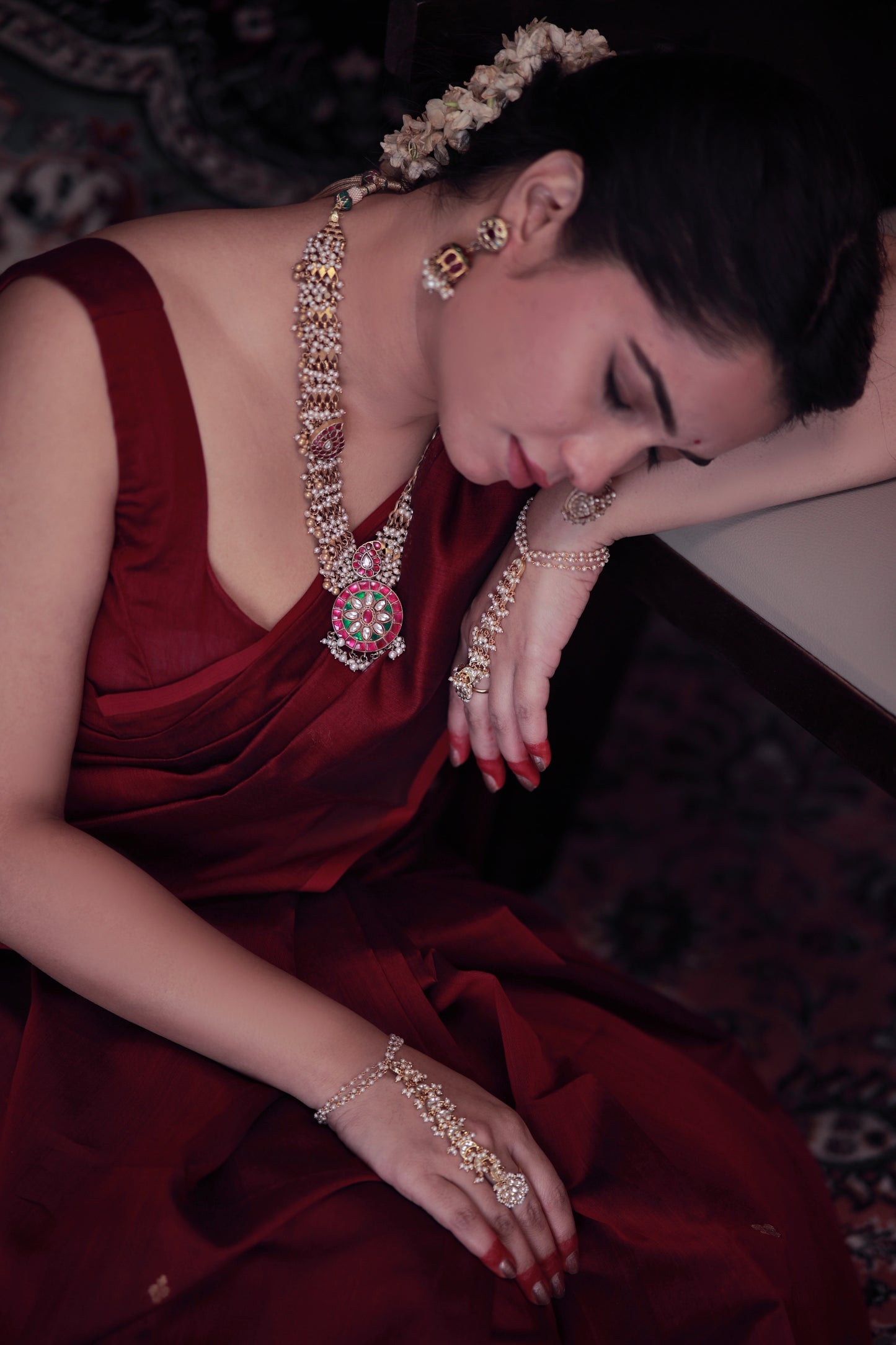 Deep maroon Maheshwari saree with zari bootis all over