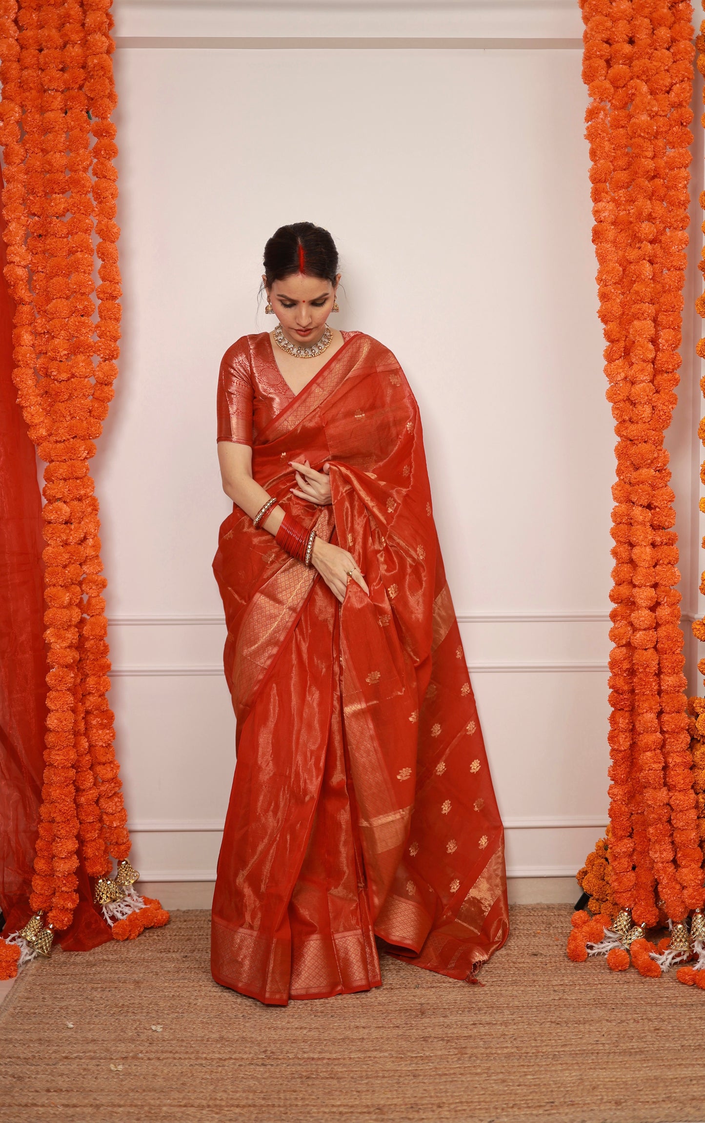 Red maheshwari tissue silk saree with flower motifs all over