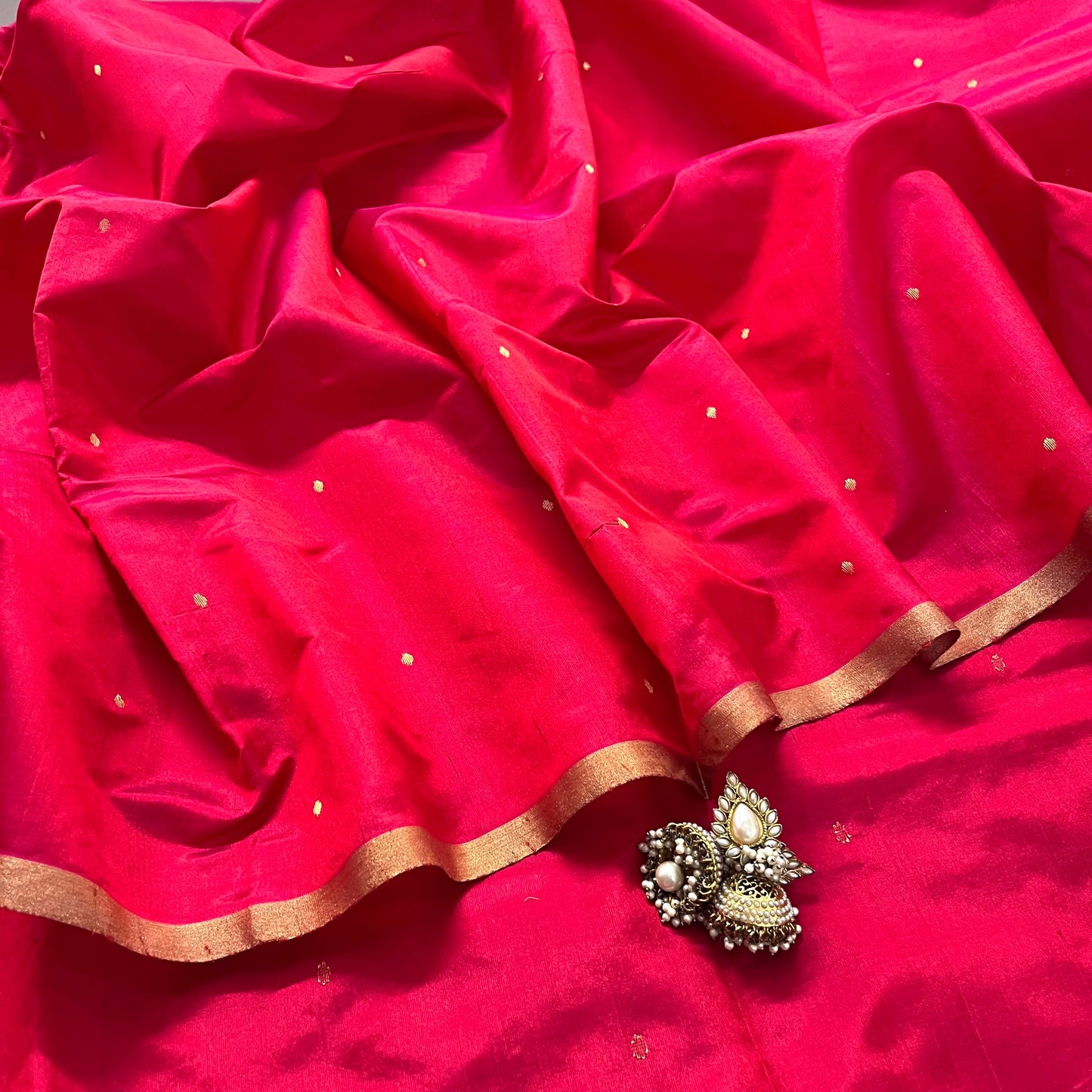 Crimson red chanderi silk saree with zari bootis all over