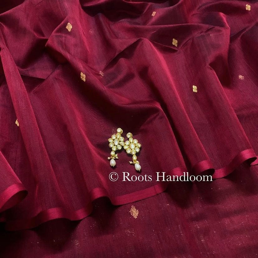 Deep maroon Maheshwari saree with zari bootis all over