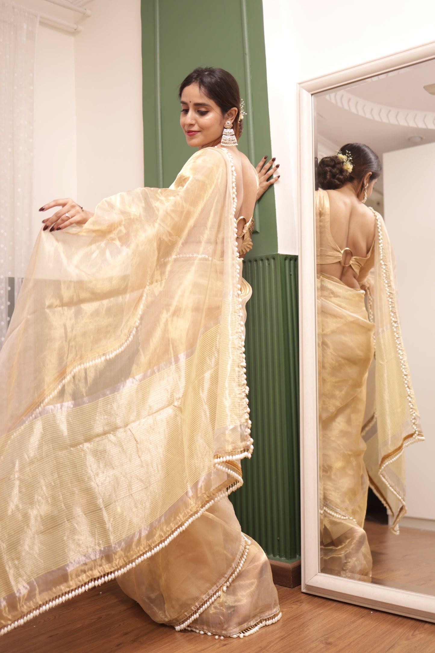 Molten gold chanderi tissue silk saree with dangling pearl border