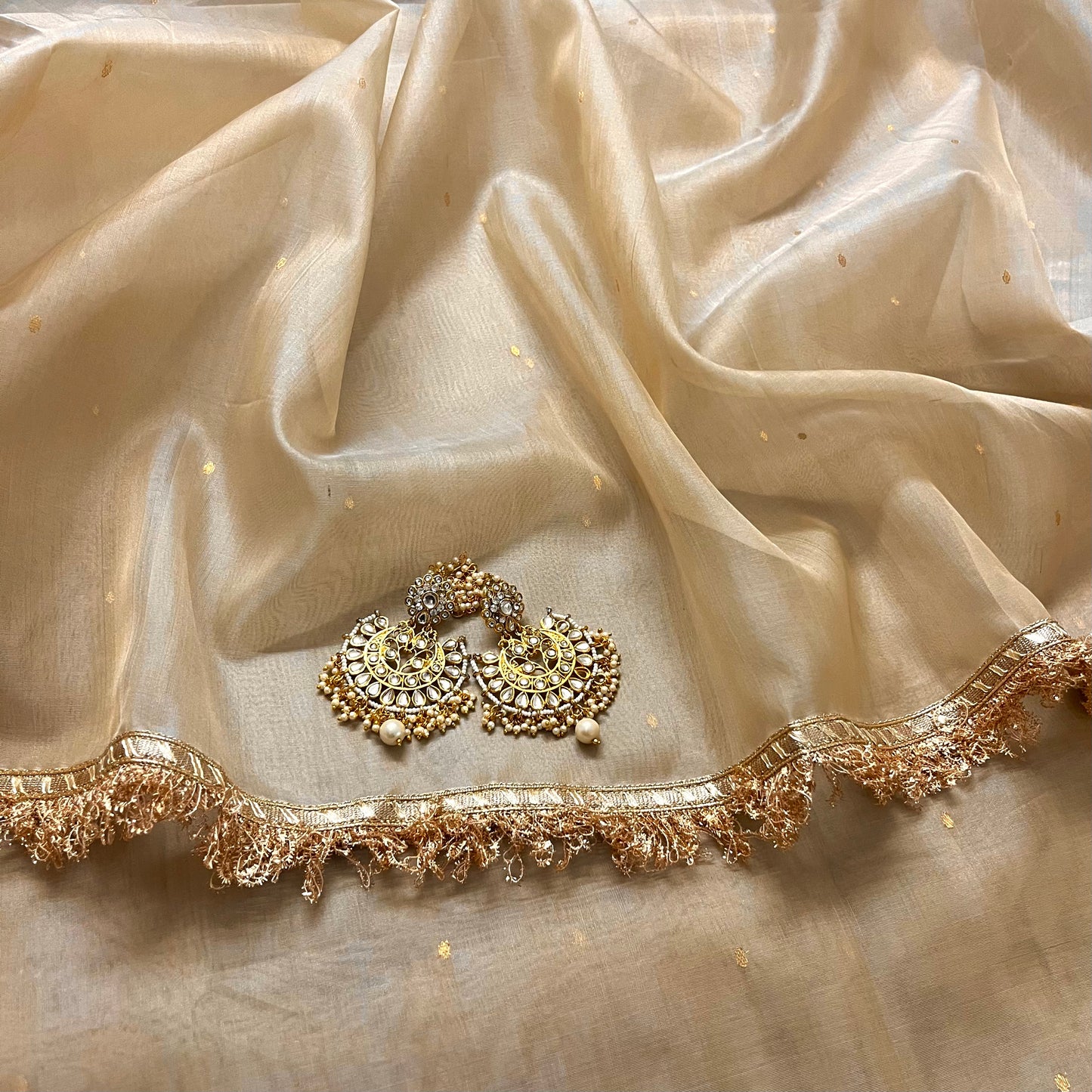 Beige gold Chanderi organza silk saree with zari bootis all over