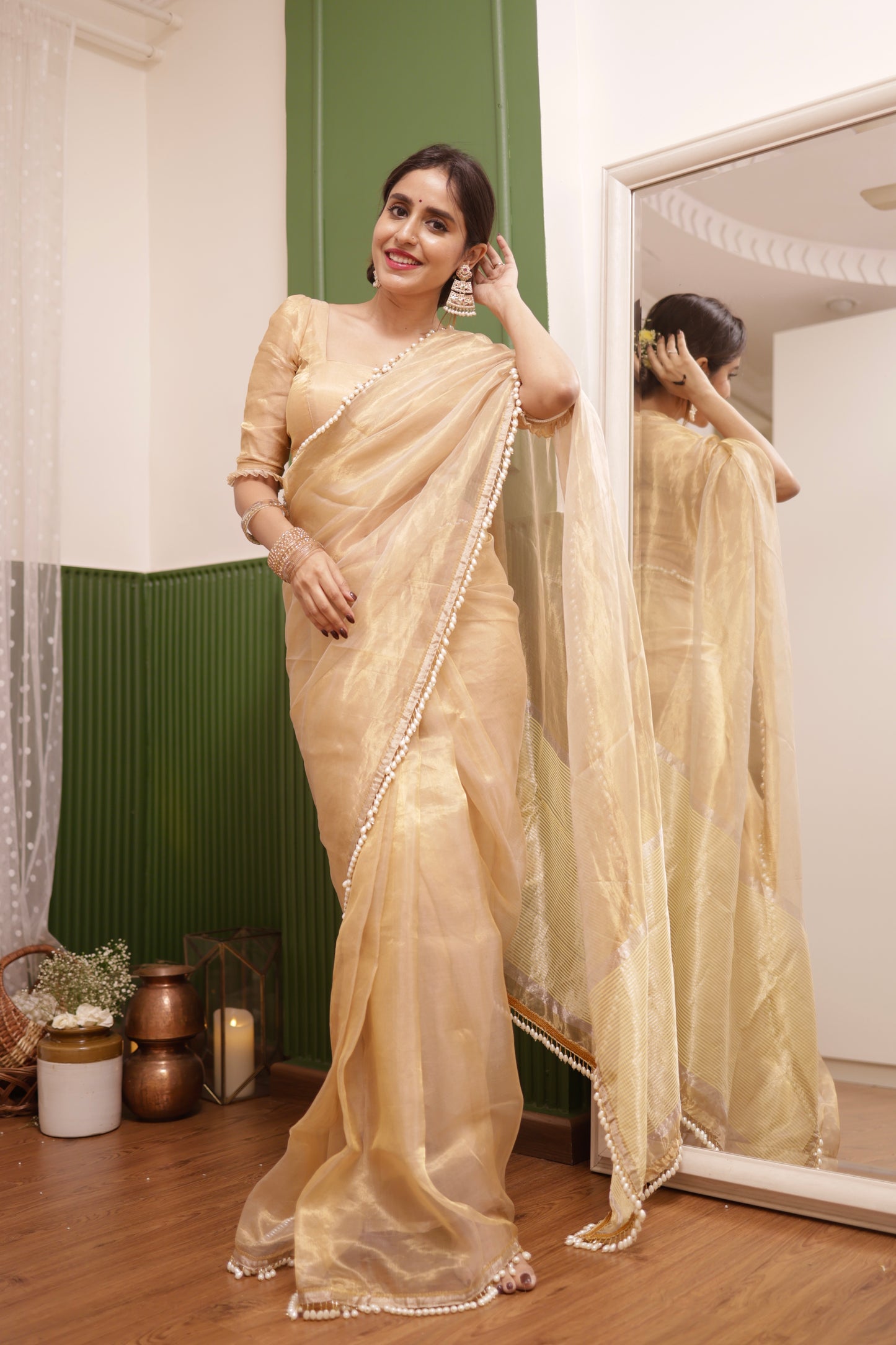 Molten gold chanderi tissue silk saree with dangling pearl border