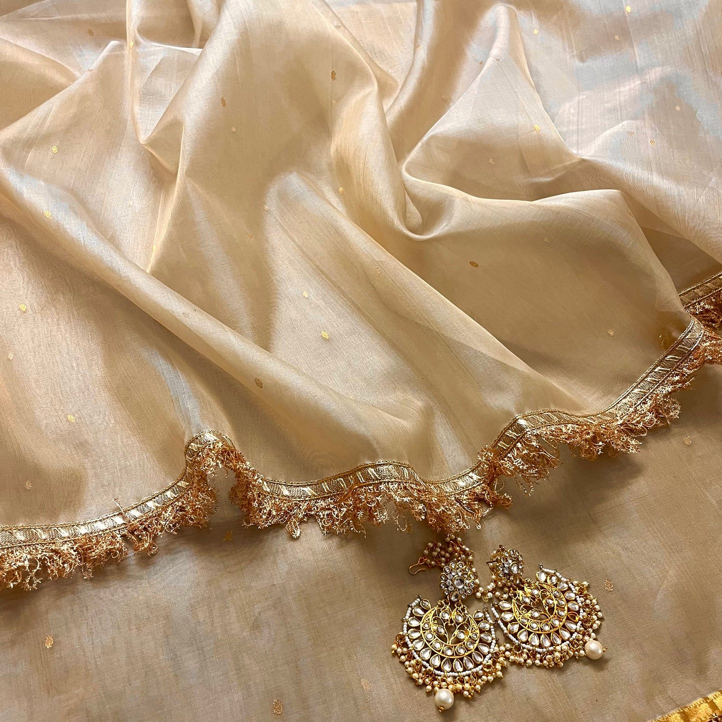 Beige gold Chanderi organza silk saree with zari bootis all over