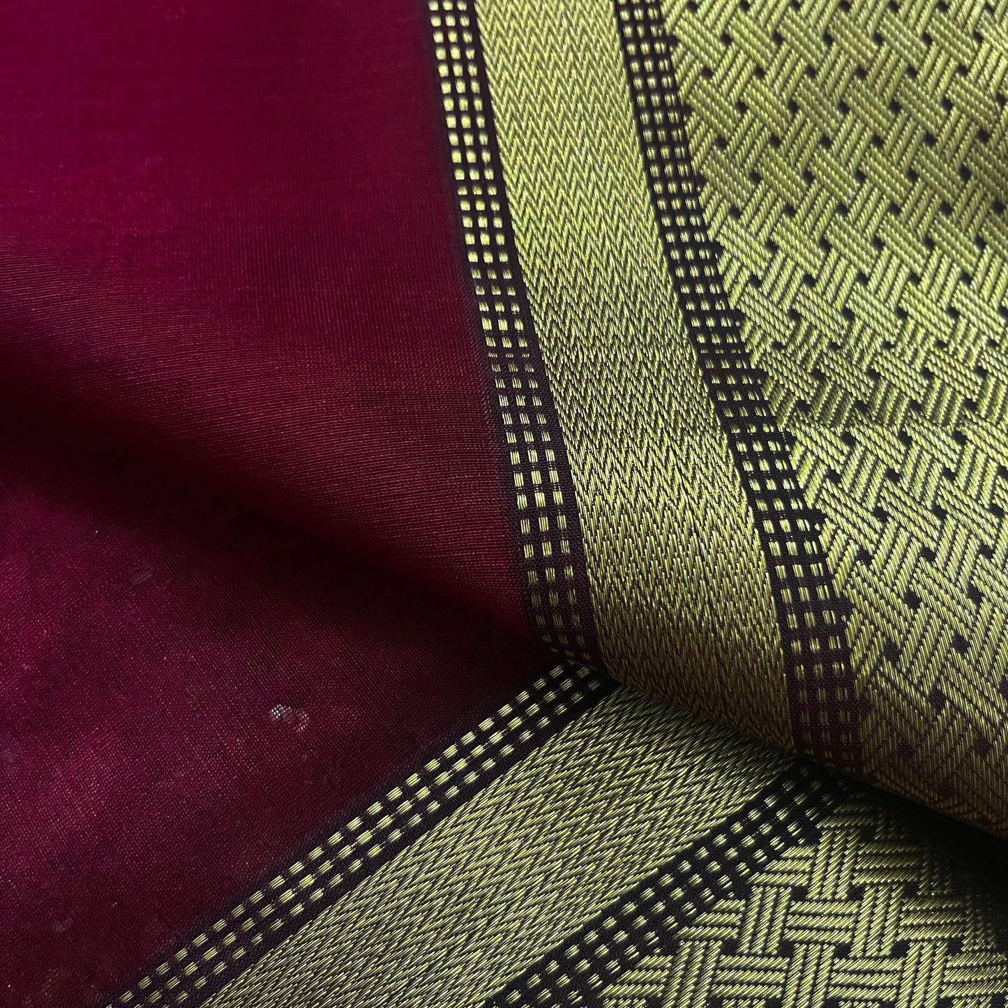 Deep maroon Maheshwari saree with zari motifs on pallu