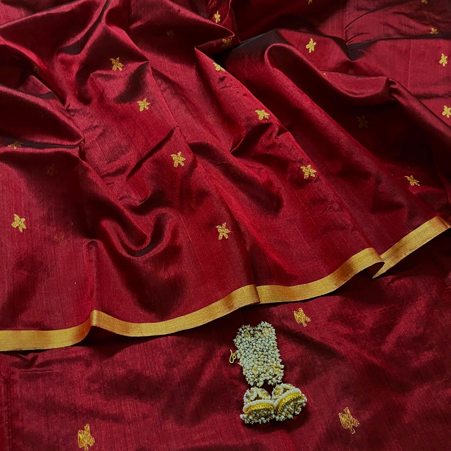 Deep maroon chanderi silk saree with flower bootis all over