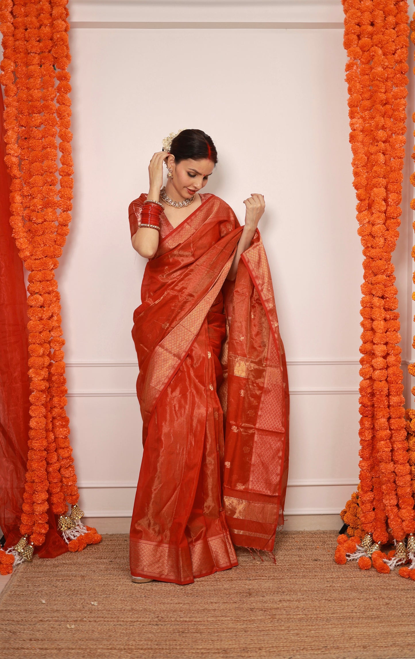 Red maheshwari tissue silk saree with flower motifs all over