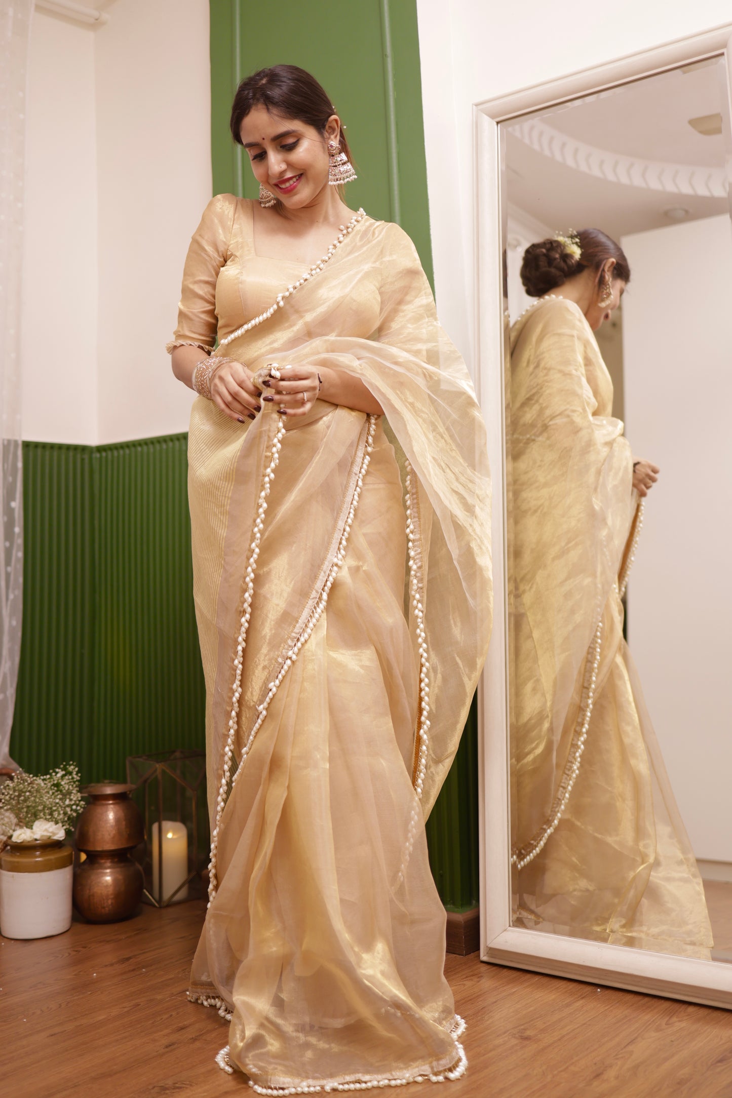 Molten gold chanderi tissue silk saree with dangling pearl border