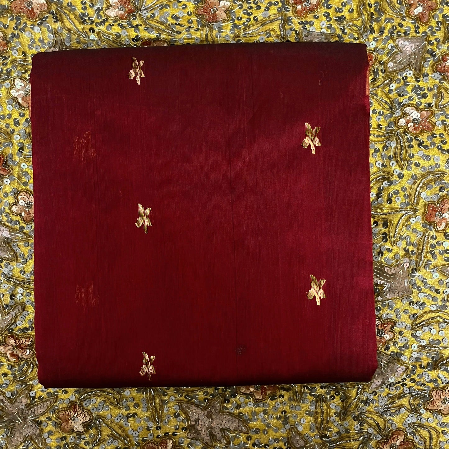 Deep maroon chanderi silk saree with flower bootis all over