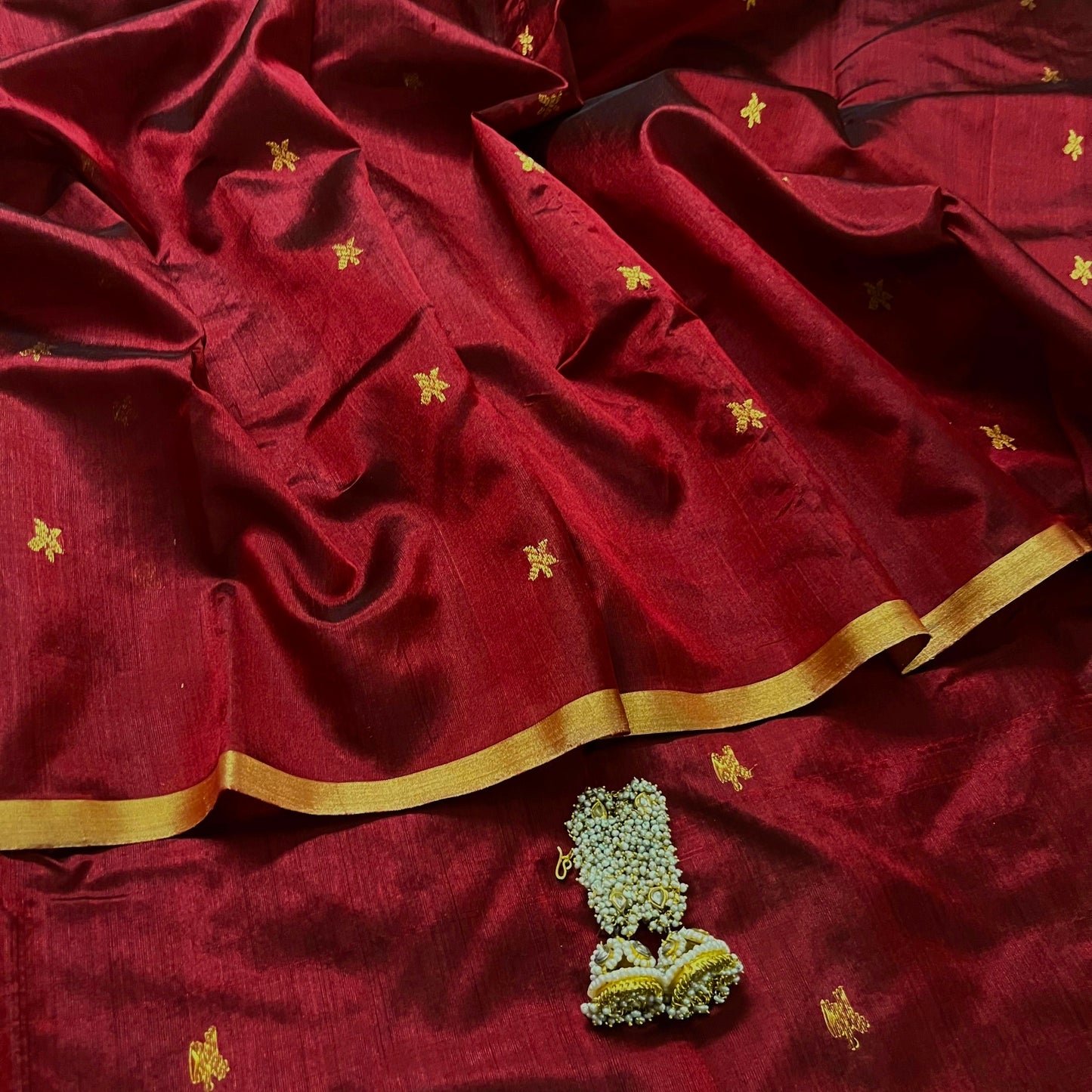 Deep maroon chanderi silk saree with flower bootis all over