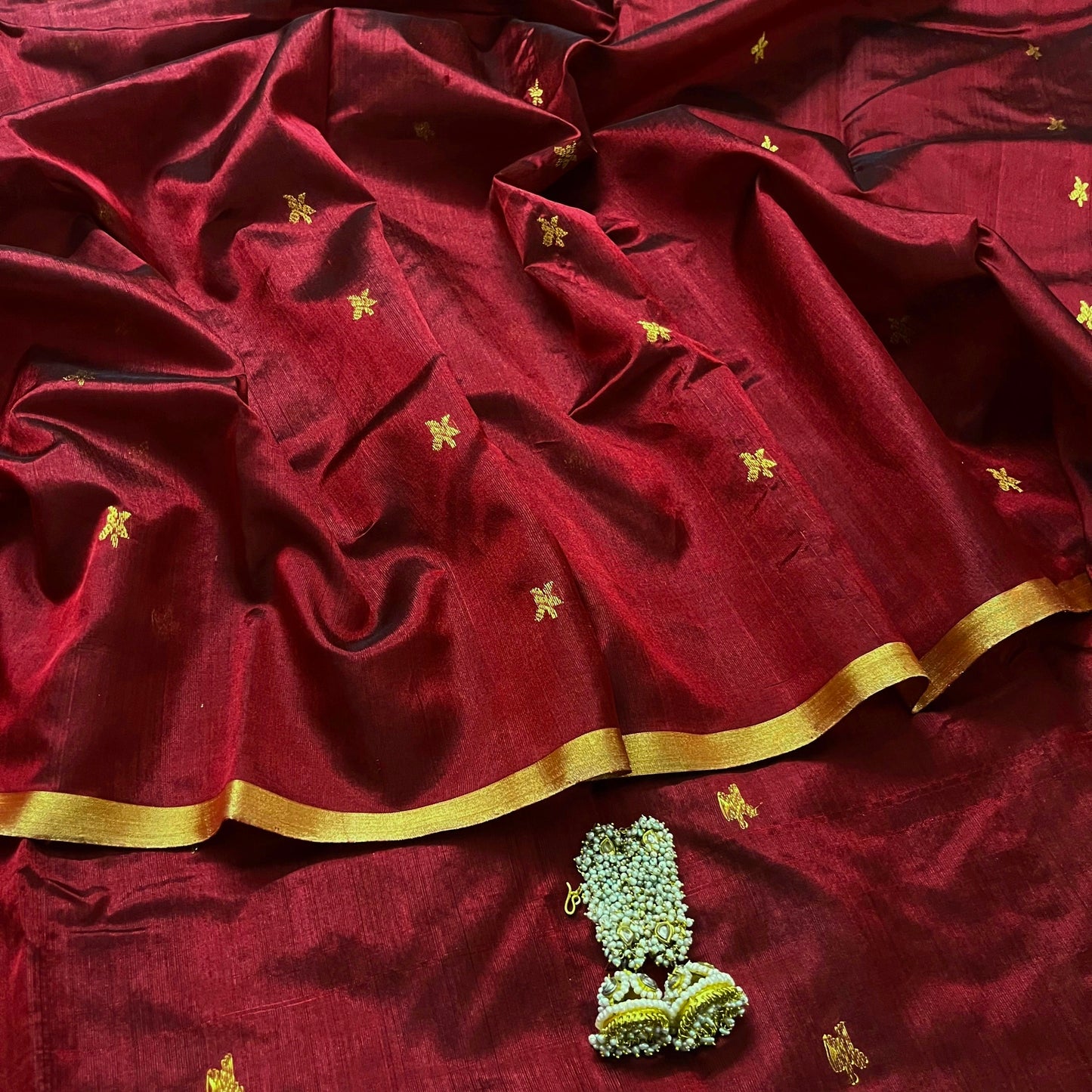 Deep maroon chanderi silk saree with flower bootis all over