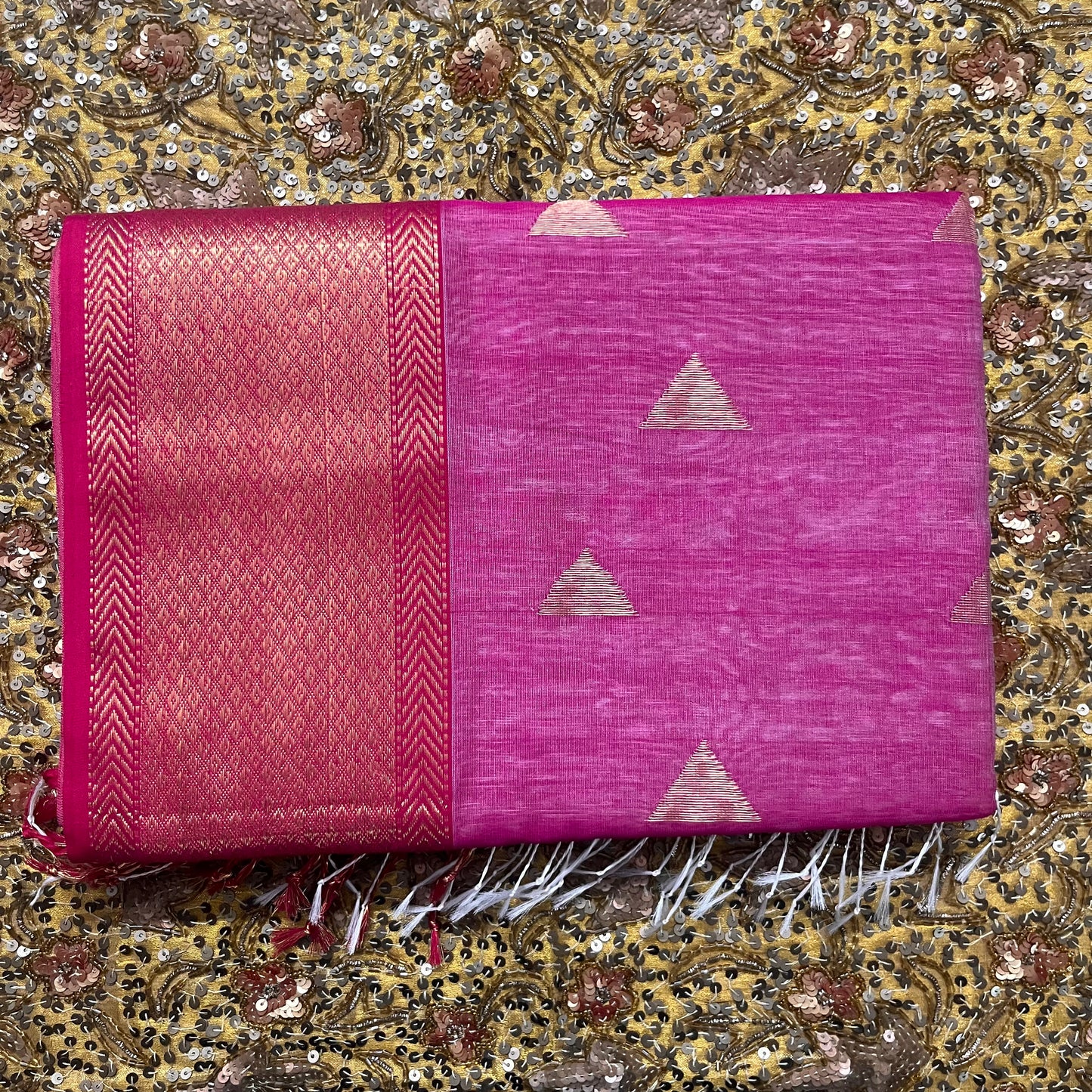 Off white and pink maheshwari saree with triangular bootis all over