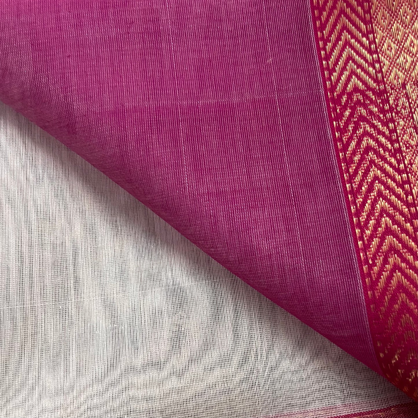 Off white and pink maheshwari saree with triangular bootis all over