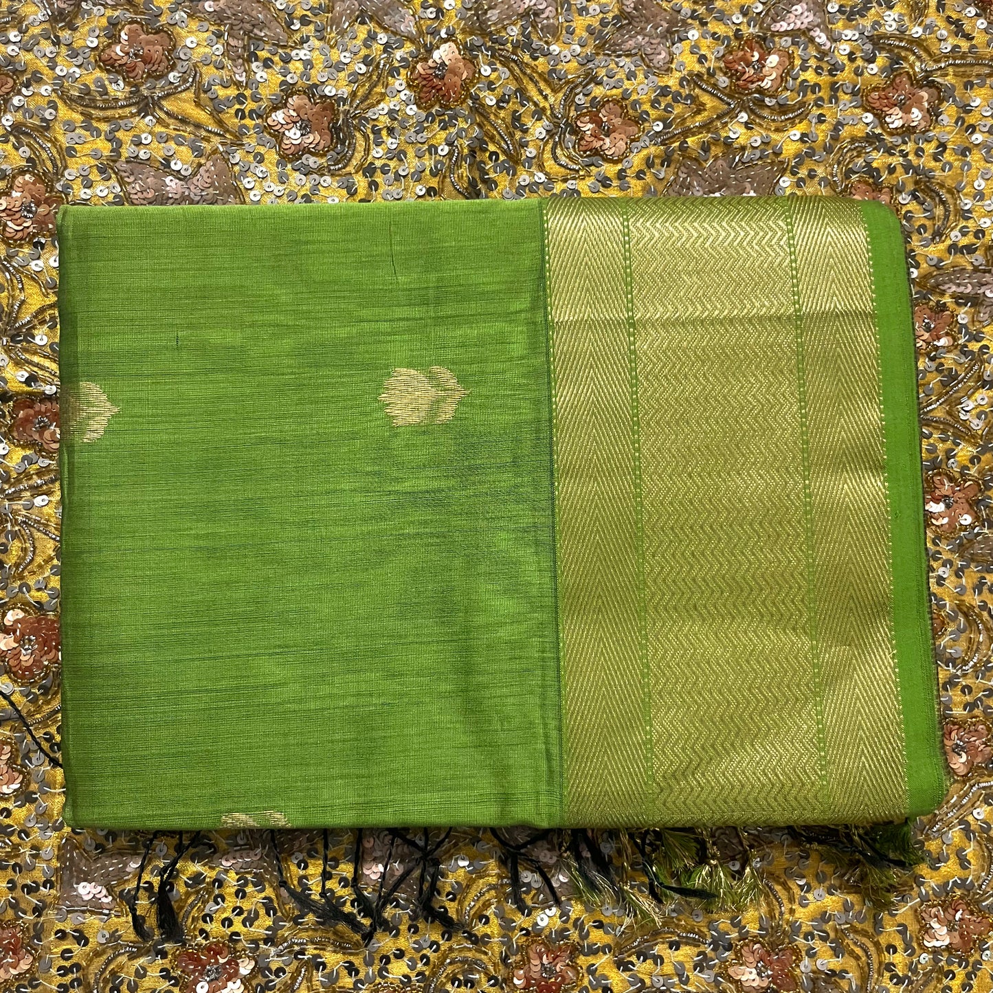 Olive green maheshwari saree with flower motifs all over