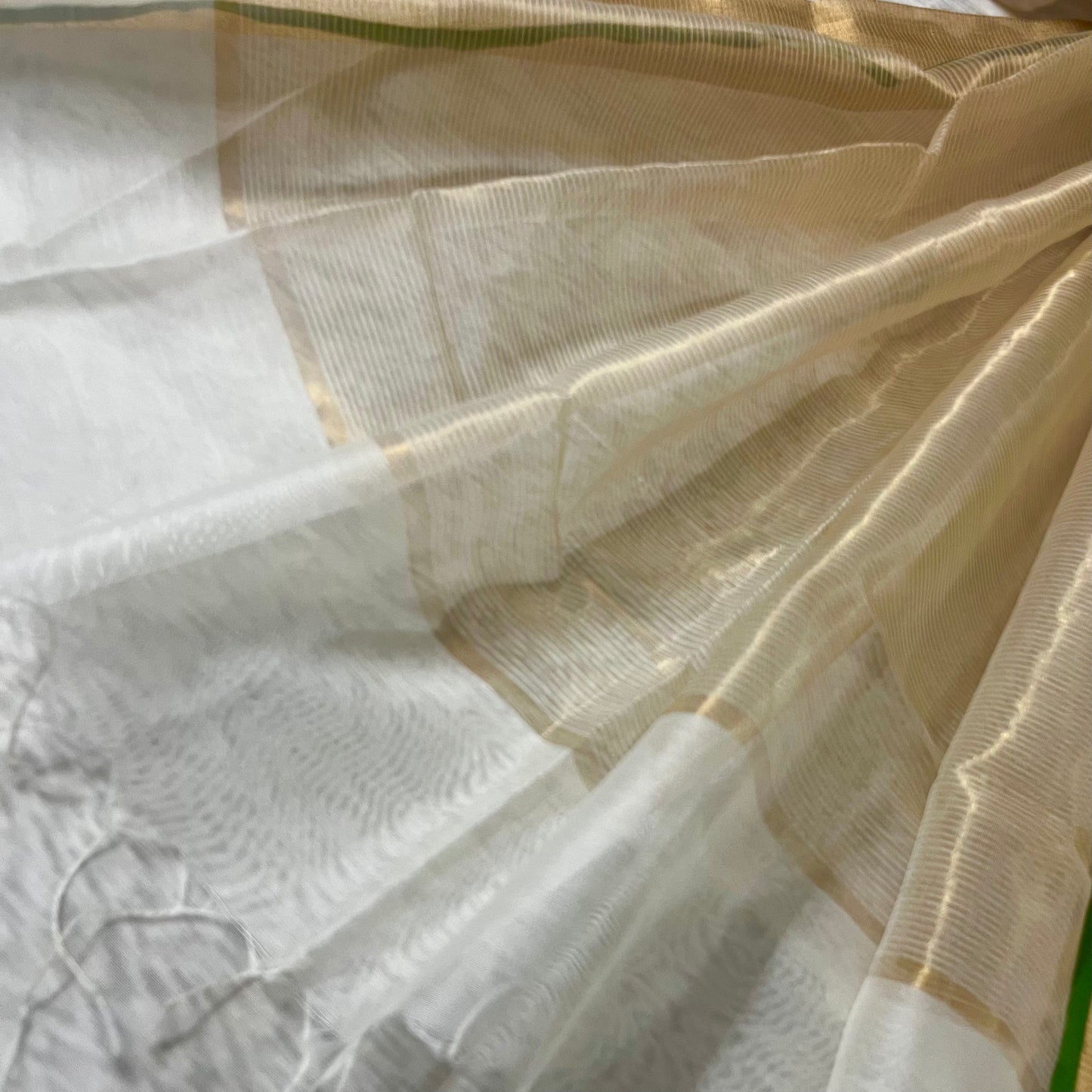 Off white and green maheshwari saree with zari lines on pallu