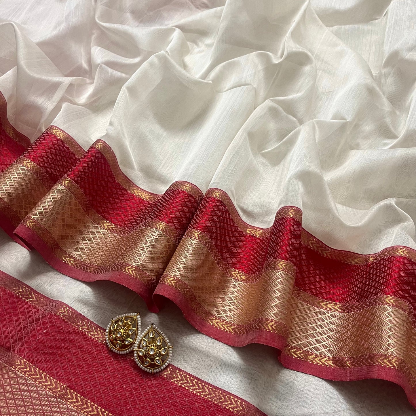 Off white and maheshwari sare with resham border