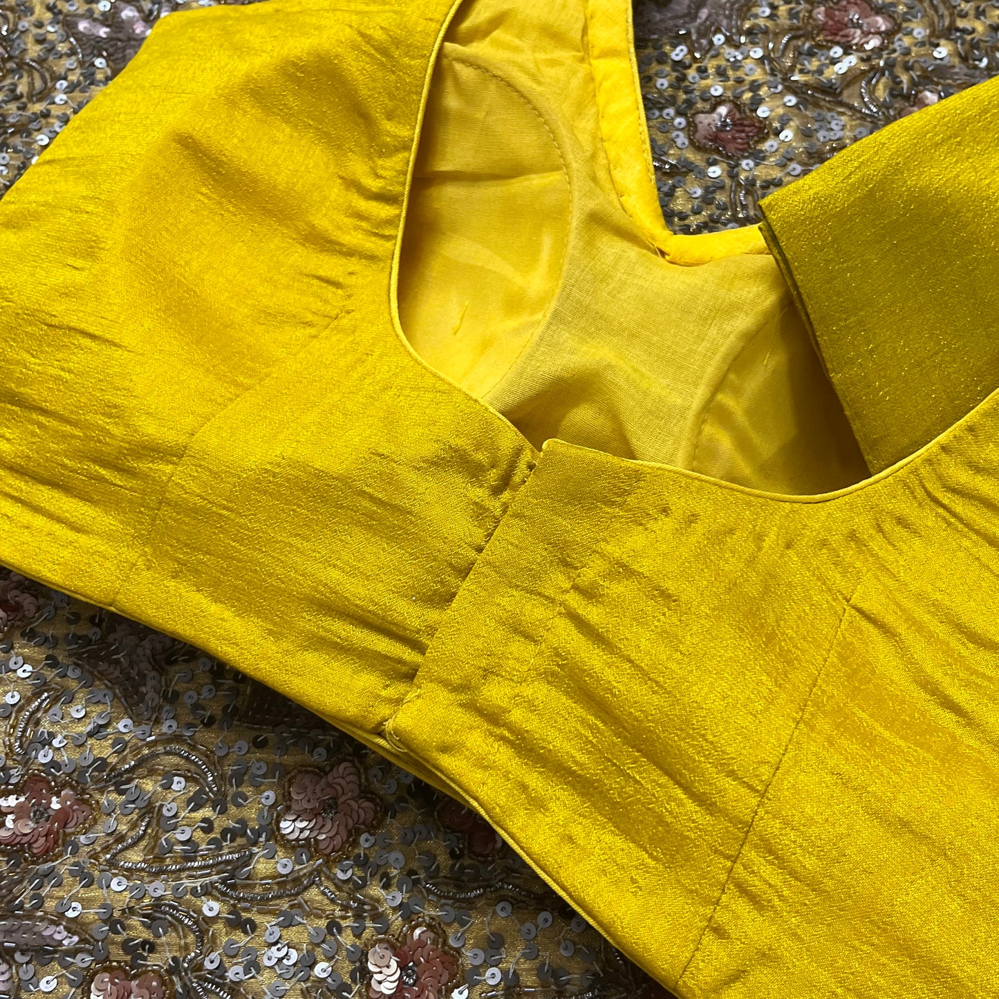 Yellow stitched padded silk blouse