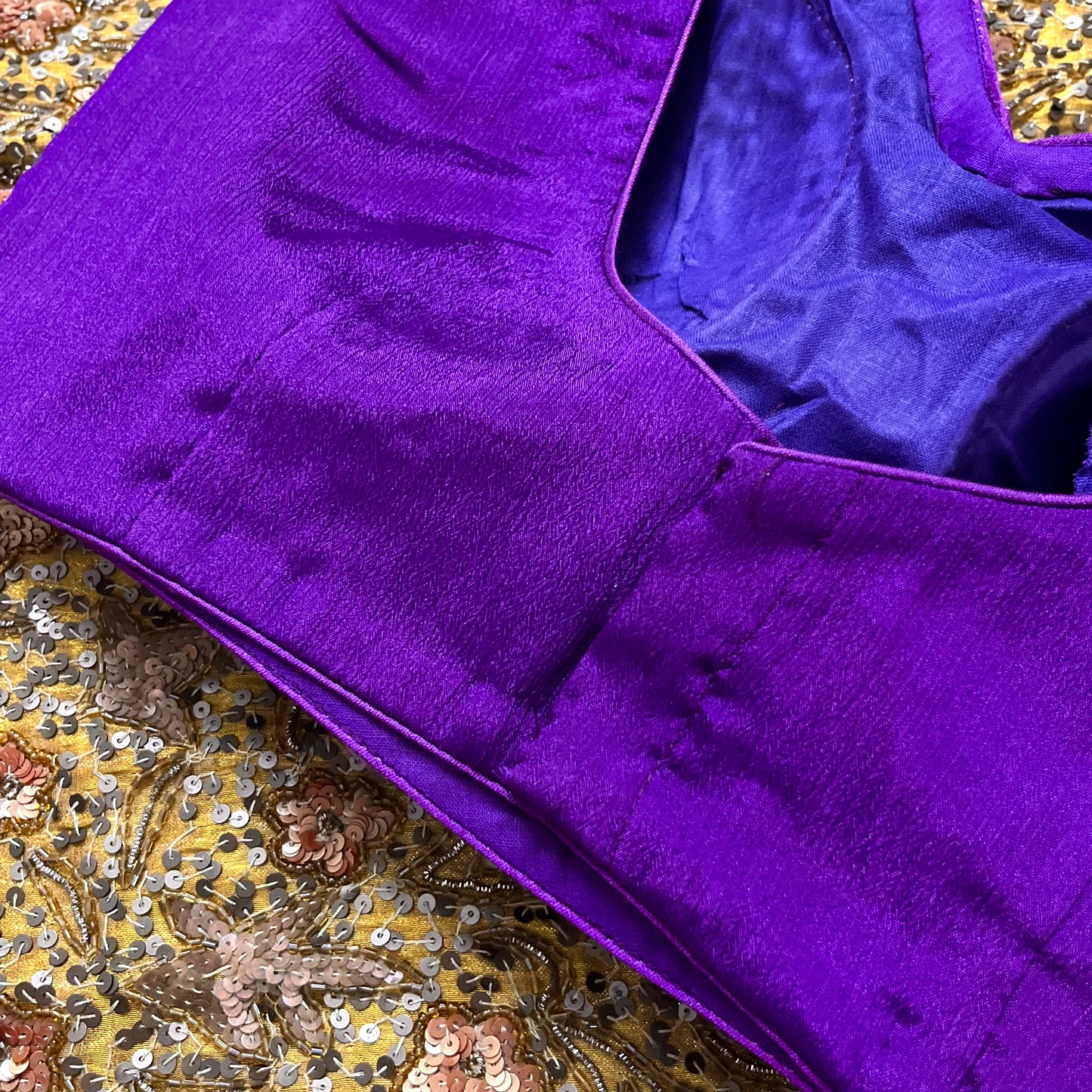 Violet stitched padded silk blouse