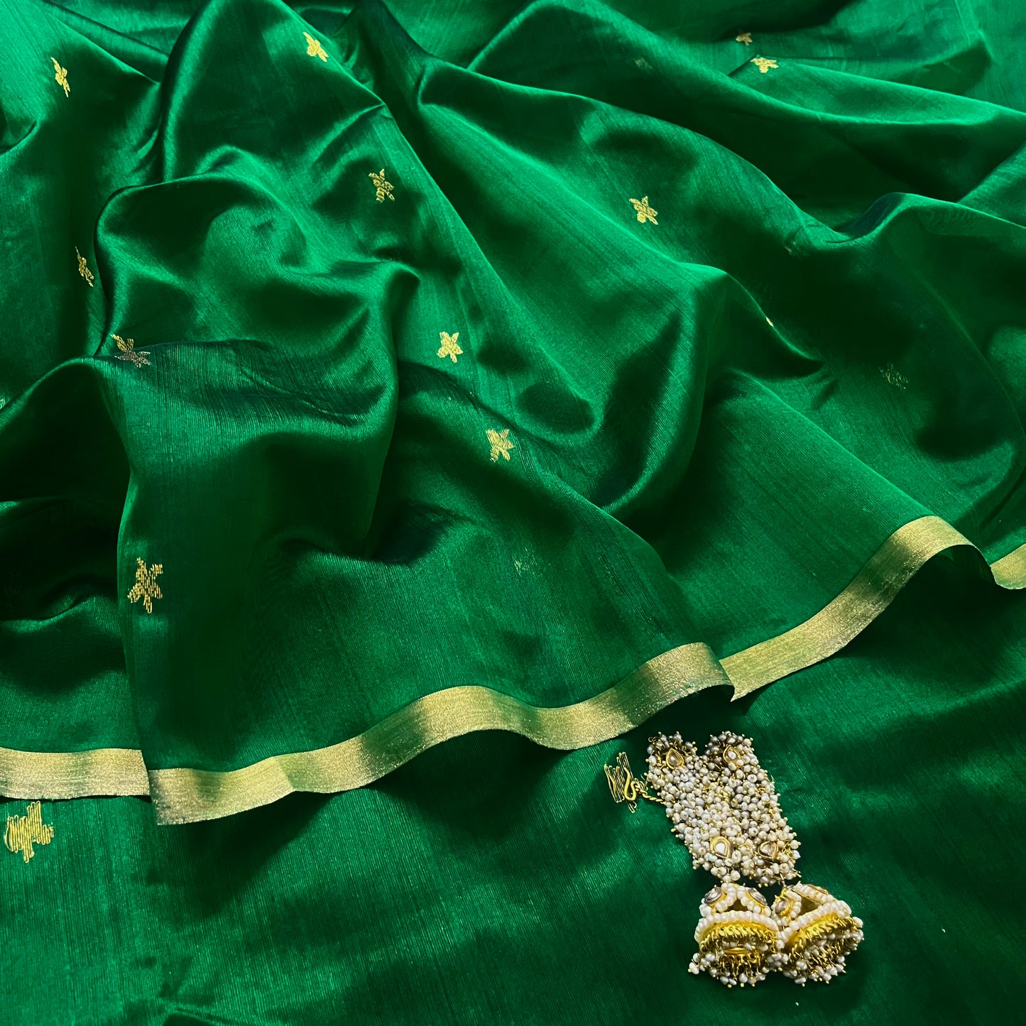 Emerald green chanderi silk saree with flower bootis all over