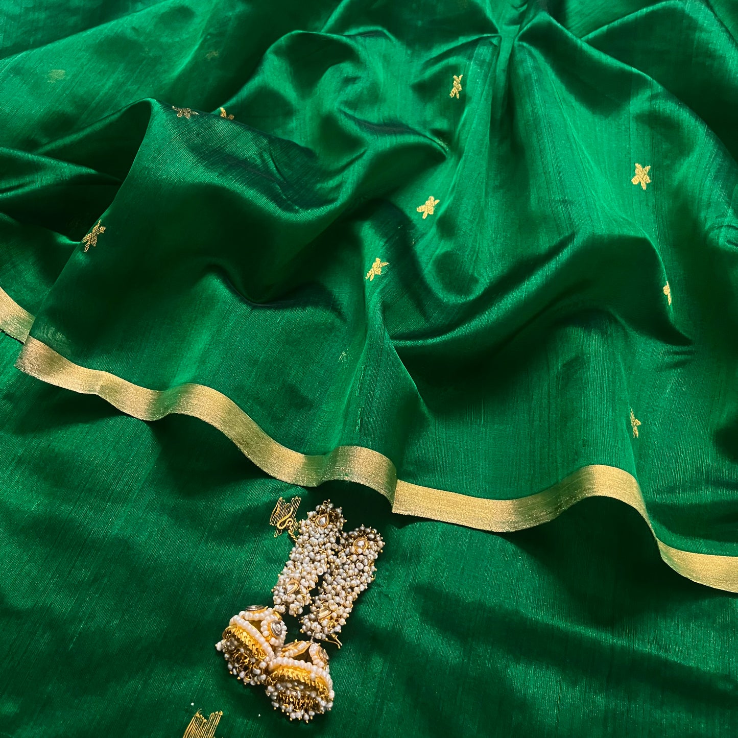 Emerald green chanderi silk saree with flower bootis all over