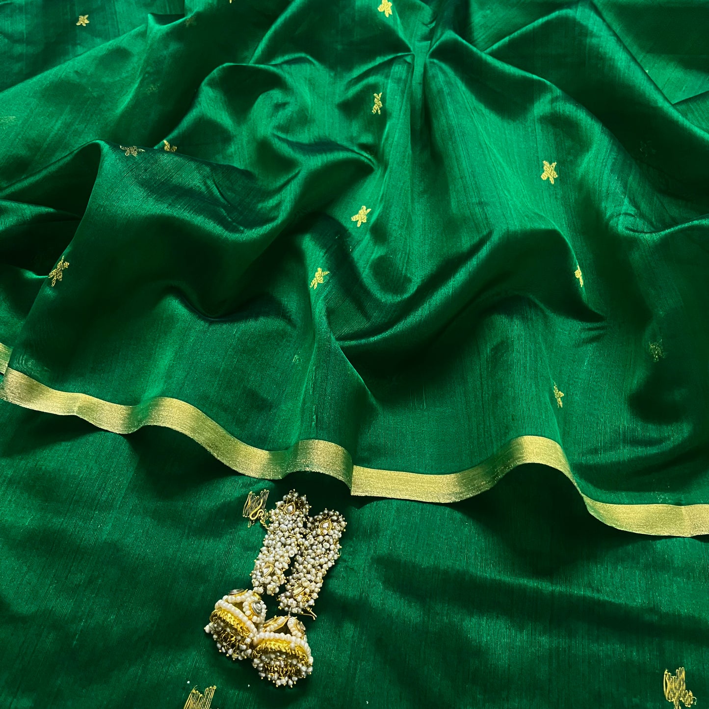 Emerald green chanderi silk saree with flower bootis all over