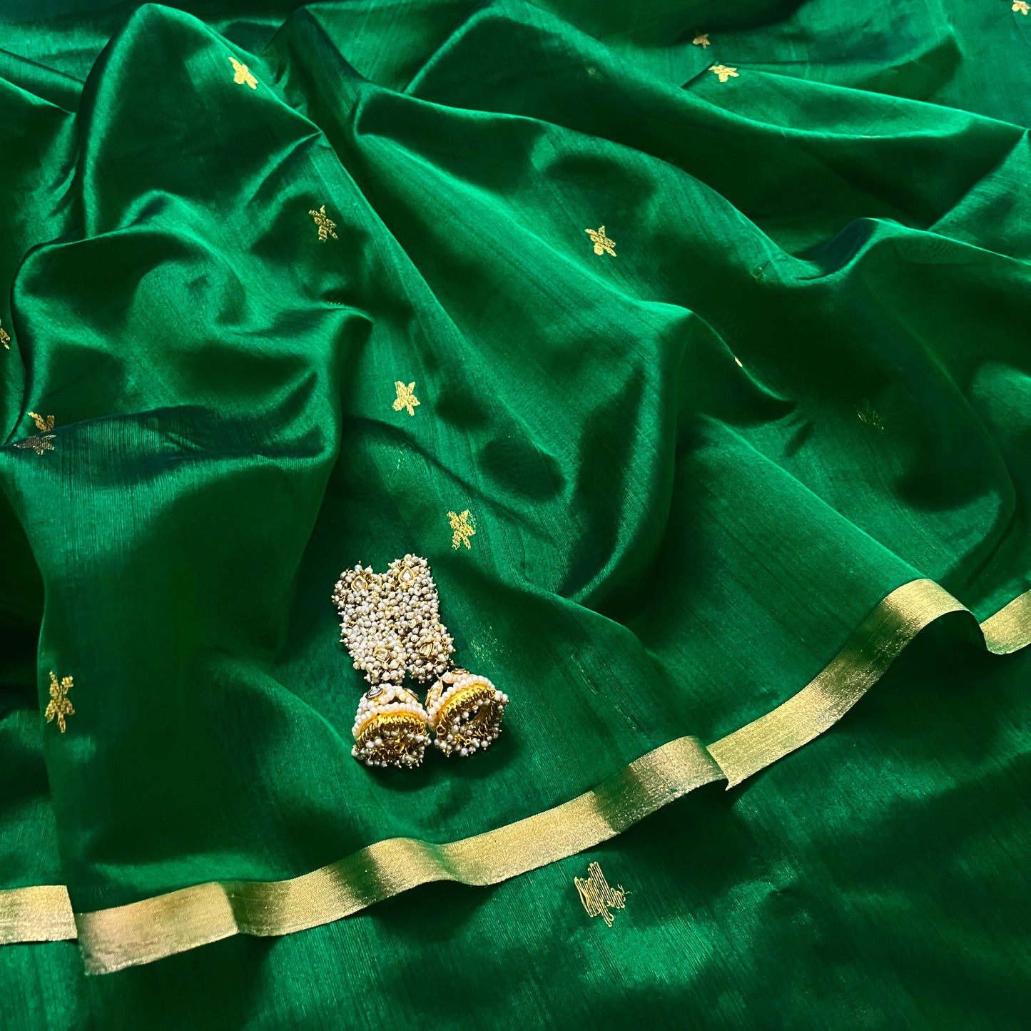 Emerald green chanderi silk saree with flower bootis all over