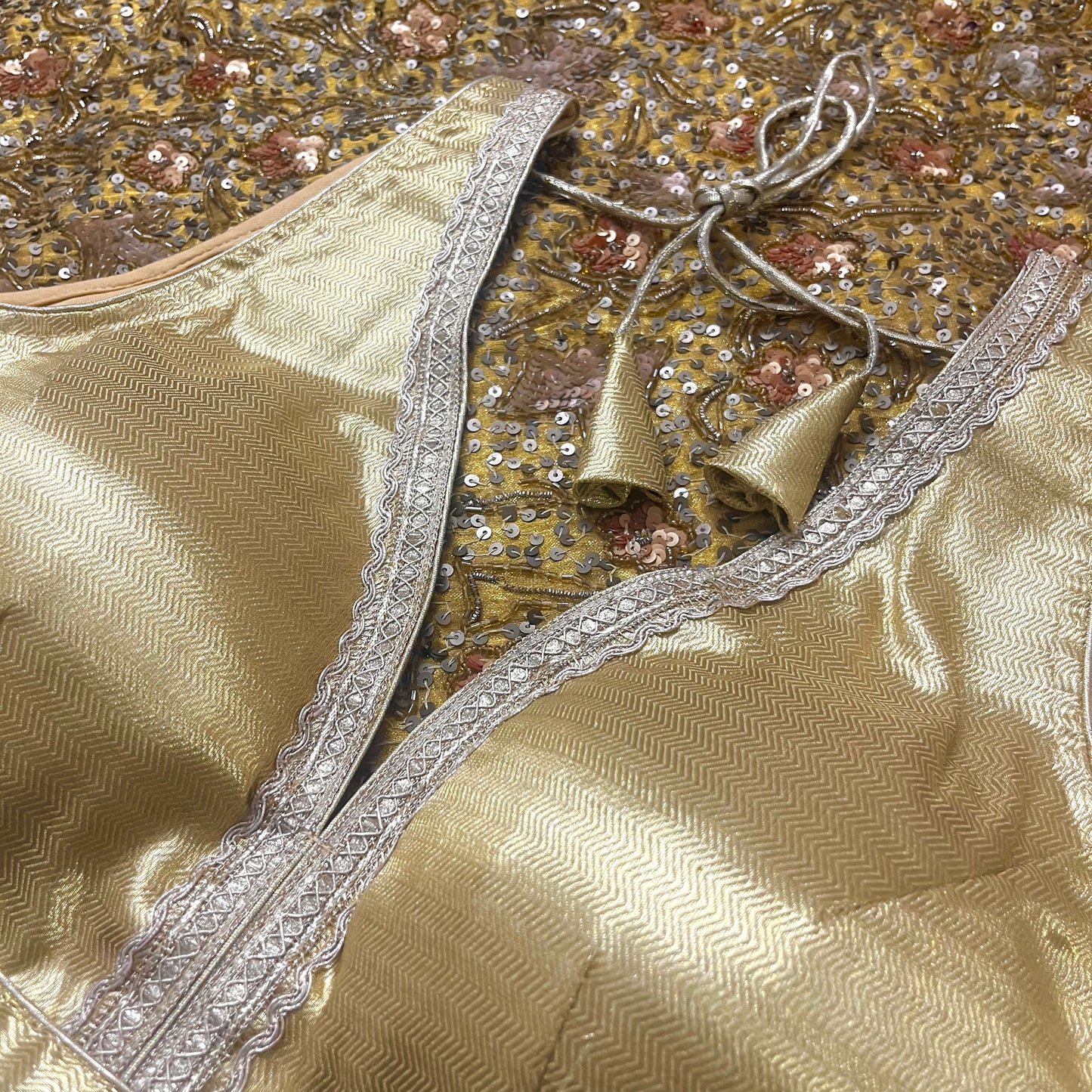 Gold stitched padded silk blouse