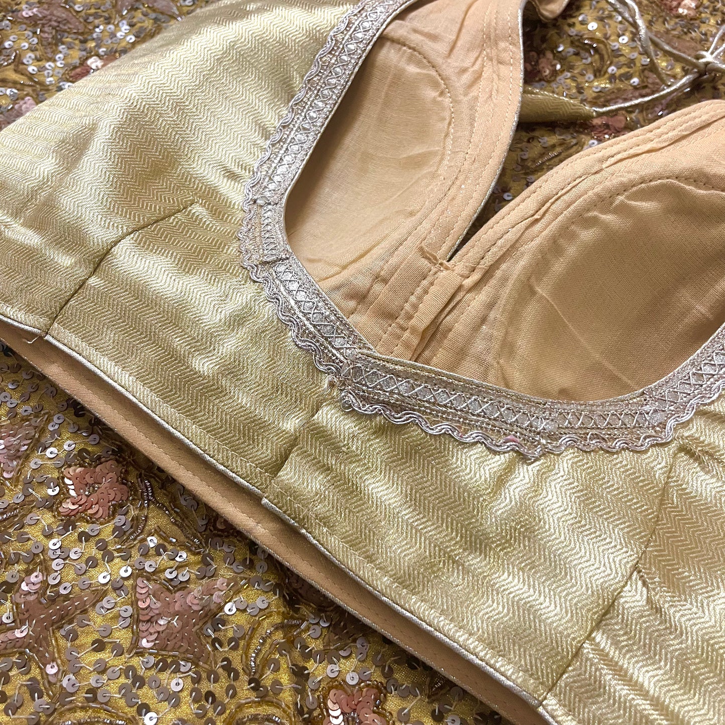 Gold stitched padded silk blouse