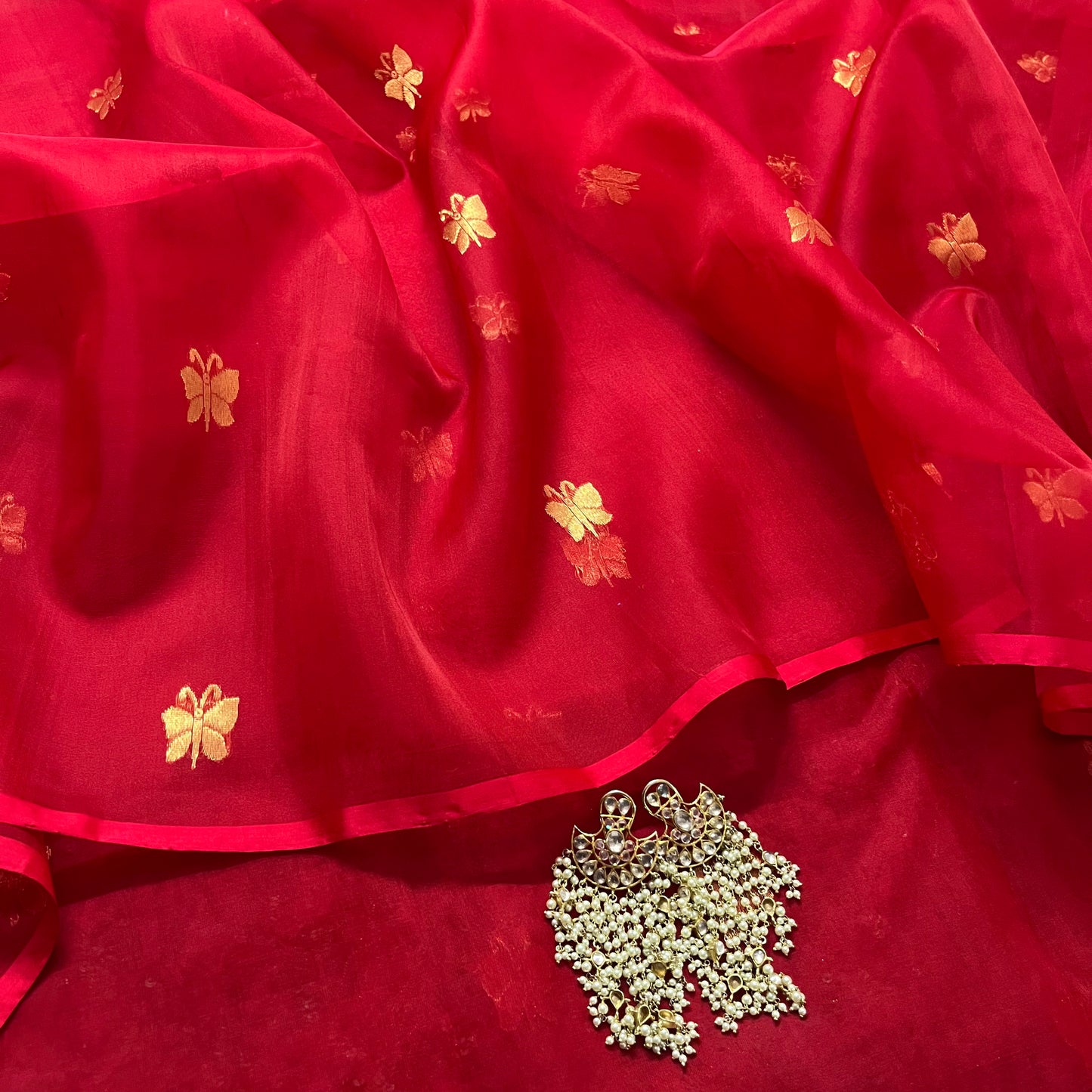 Red chanderi organza silk saree with butterfly motifs all over